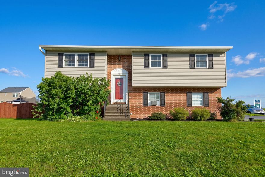 This move-in ready 4-bedroom home sits on a lovely corner lot with a fenced backyard. The main level boasts a bright, open layout featuring an open-concept kitchen and dining area, with sliding glass doors leading to the deck. Down the hall are three bedrooms, including a primary suite with two closets and a private en-suite bath. Two additional bedrooms and a full guest bath complete the main floor. The fully finished lower level offers upgraded LVP flooring, a spacious family room with sliding doors to the backyard, plus an extra bedroom or flex space. Conveniently located just minutes from restaurants, shopping, local amenities, and with easy access to major roadways.