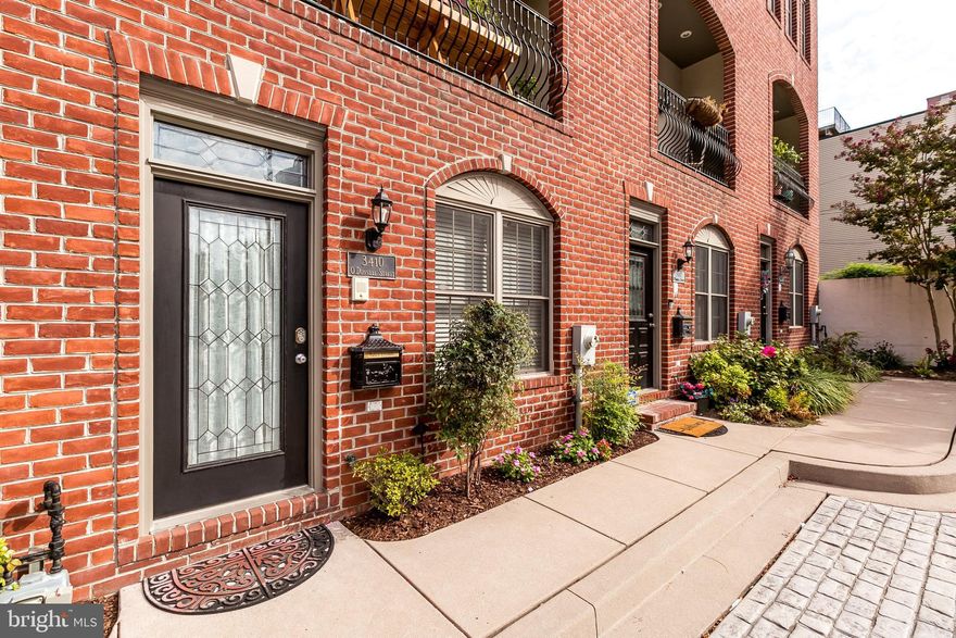 Garage Townhome in perfect courtyard setting.   4 Very spacious living levels with a first floor guest room/ office and full bath.  Amazing flow -  open floor plan with custom finishes throughout - highly upgraded.  Chefs' kitchen with island and a breakfast bar.  Large living room with exposed brick and access to balcony that overlooks courtyard.  Master suite with gas fireplace, walk-in closet and large master bathroom w/  jacuzzi tub, separate shower and HEATED FLOORS in bathroom.  Another large bedroom and full bath on master bedroom level.   Upper level has custom wet bar with wine fridge, ice maker and plenty of wine/ liquor storage.  Huge deck that wraps around front and back of upper level room and has water views.   Tons of large closets throughout the house.  Amazing house in amazing location.  VIRTUAL TOURS &  VIRTUAL SHOWINGS  AVAILABLE