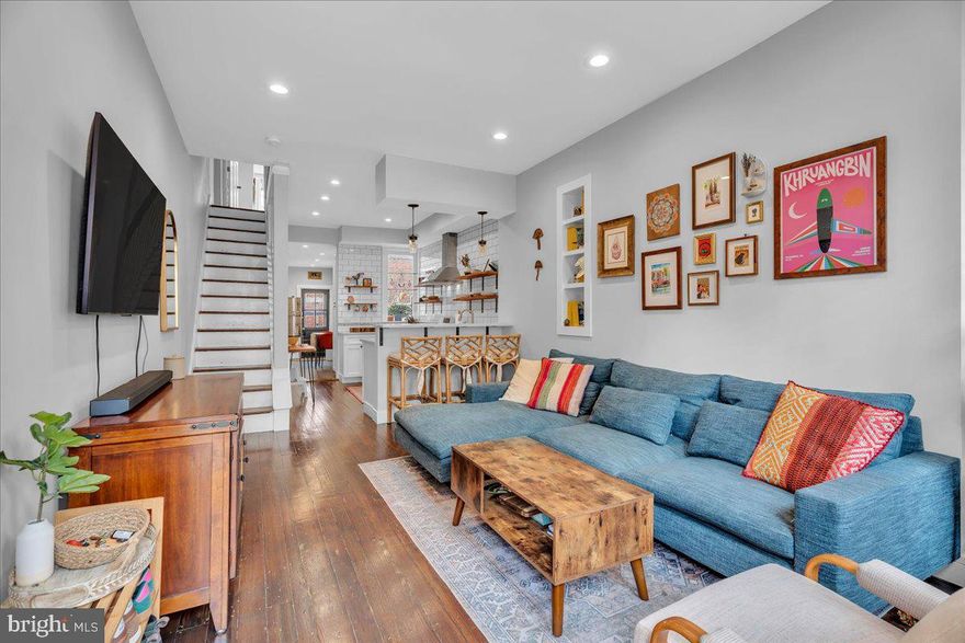 Welcome to 1238 E. Susquehanna Ave — a charming and thoughtfully updated 2-bedroom, 2-bath Fishtown rowhome blending character and modern comfort.

Step inside to a bright and airy living space, where high ceilings and oversized windows create an inviting, open feel. The home showcases original hardwood floors that add warmth, character, and timeless appeal. The kitchen is designed for both everyday living and entertaining, featuring quartz countertops, stainless steel appliances, and open wood shelving that adds both function and style.

Toward the rear of the home, a flexible bonus area offers the perfect setup for a dining area or home office, complete with a beautifully preserved vintage built-in that nods to classic Philadelphia charm. A conveniently located laundry area completes the first floor.

Out back, enjoy a rare and expansive private yard with tremendous potential—an ideal outdoor space that’s ready to be refreshed and transformed into your own city oasis for dining, gardening, or relaxing around a fire pit.

Upstairs, you’ll find two spacious bedrooms and two full bathrooms. The primary suite is full of character, showcasing exposed brick, ceiling beams, and ample closet space, along with a thoughtfully designed en-suite bath. Eye catching details in this bathroom include the handcrafted and reclaimed wood vanity and bronze fixtures.  The second bedroom is bright and welcoming, now enhanced with newly added hardwood flooring and an adorable bay window. A well-appointed hall bath with timeless finishes sits just between the two.

Additional updates include a new roof, offering peace of mind for years to come. The dry basement provides excellent storage or workspace options.

Located just steps from Frankford Avenue, you’re within easy reach of Fishtown’s best restaurants, coffee shops, parks, and entertainment, with convenient access to I-95 and public transit.

A true Fishtown gem offering space, style, and location.