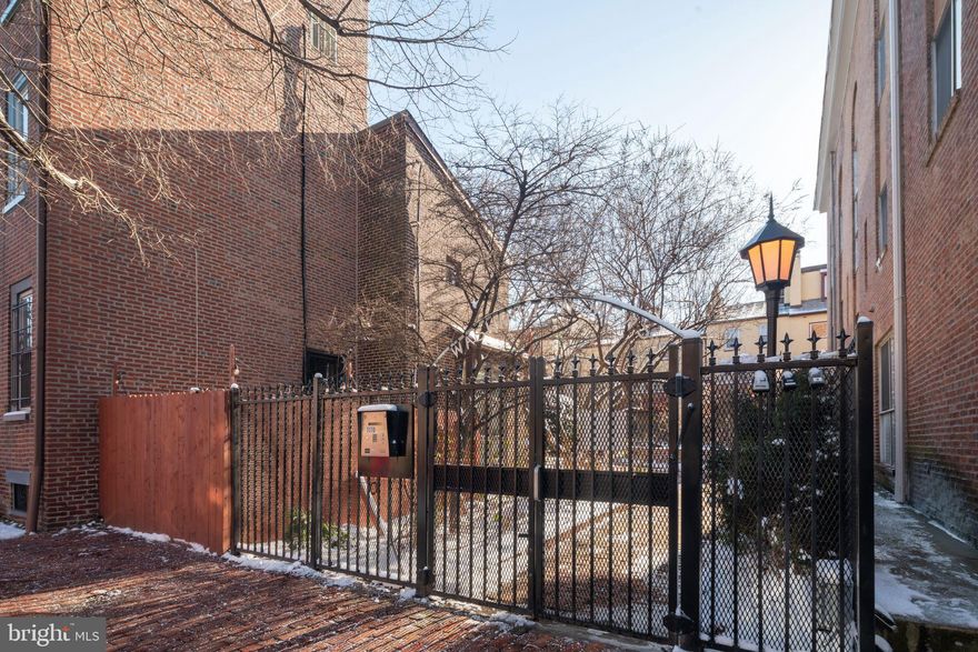 Washingtown Mews is a private gated community. 1110 Lombard is also known as 502 S. 11th St Philadelphia, 19147.  
Enter into an open Great Room with south facing windows, wood floors and a working fireplace.  The lead to the kitchen/dining room is framed by a brushed metal and glass trimmed staircase. The kitchen dining room features large windows along with a half bath. The primary bedroom floor is carpeted and has a large dressing room or second bedroom. White clean and near perfect best describes the bath. The apartment includes a washer dryer. Kahn Park at 11th and Pine and Seger Park at 11th and Lombard offer more open space options. This location is perfect for walking to schools, hospitals, restaurants, shopping and all arts activities. Monthly parking is nearby.  Permit parking is also an option.The condominium fee is collected once a year @$3,600.,additionally there is a monthly courtyard maintenance fee of $80.00 per month. Washington Mews Condominium Association is managed by Cobrin ,610 667 1122.There address is P.O Box 336 ,Narberth,PA 19072