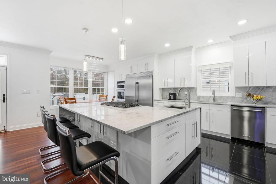 This stunning residence has been thoughtfully renovated to embody modern luxury, comfort, and timeless design. From the moment you arrive, the home’s beautiful curb appeal creates a lasting first impression, offering a sense that you are stepping into something truly special. Inside, natural light fills every room, creating a bright, warm, and welcoming atmosphere that enhances the home’s refined finishes and elegant details. The fully renovated kitchen serves as the heart of the home, featuring striking waterfall quartz countertops, elegant black granite floors, and a spacious center island designed for both preparation and gathering. Its modern finishes and generous layout make cooking and entertaining effortless. The open layout creates a natural flow throughout the main living spaces, making it easy to host gatherings while maintaining a sense of comfort and connection. Rich hardwood floors add warmth and sophistication, while the thoughtful renovation reflects careful attention to blending style, functionality, and everyday comfort. Generous storage and a smart layout further support easy, organized living. The primary suite offers a peaceful retreat, designed to provide comfort and privacy at the end of the day. A vaulted ceiling and fireplace create a relaxing and elegant atmosphere, while the walk-in closet provides excellent storage. The spa-inspired bathroom features a freestanding soaking tub, oversized open shower, and dual vanities, creating a space designed for relaxation and renewal. The outdoor spaces have been designed to extend the home’s sense of comfort and connection. A private backyard, flagstone patio, pergola, and well-appointed outdoor cooking station with a Big Horn Lux grill, refrigerator, sink, and pizza oven create an ideal setting for quiet mornings, relaxed evenings, and memorable gatherings. The fenced yard adds privacy, while the patio heater allows this serene setting to be enjoyed in every season. Whether dining on the patio, enjoying morning coffee outdoors, or simply unwinding at the end of the day, this space offers a wonderful backdrop for daily life. Located on a charming tree-lined street, the surrounding neighborhood offers a peaceful environment with a strong sense of community. Residents appreciate the welcoming atmosphere where neighbors greet one another and take pride in their surroundings. The area offers convenient access to parks, trails, and green spaces, providing opportunities to enjoy nature just minutes from home. Shops, restaurants, and everyday essentials are also nearby, while major commuter routes provide easy access to Washington, District of Columbia, Tysons, and surrounding areas. This home offers a rare opportunity to enjoy a thoughtfully renovated residence in a well-connected location that balances tranquility, convenience, and community.