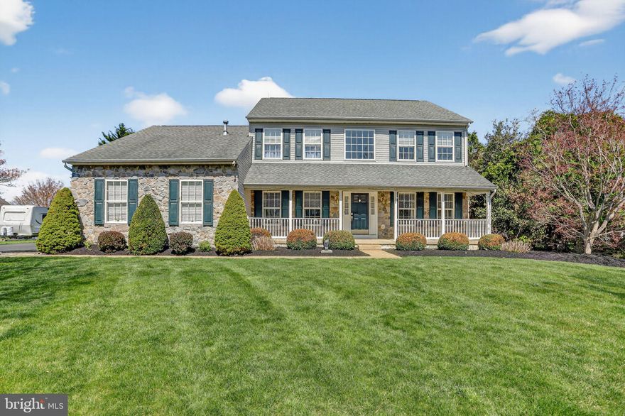 Welcome to this charming stone-front home in highly sought-after Ridgeway Estates, located in the award-winning Neshaminy School District, offering a warm, inviting feel and plenty of space both inside and out. A quaint covered front porch sets the tone, leading into a bright two-story foyer that immediately showcases the home’s classic layout. The formal living room sits to the right, while the formal dining room to the left features chair rail detailing, perfect for gatherings and everyday entertaining. The hallway includes picture molding and a convenient powder room. The spacious kitchen offers abundant wood cabinetry, granite countertops, tile backsplash, stainless steel appliances, recessed lighting, and a peninsula island. The adjoining breakfast nook features a bay window that fills the space with natural light, and a built-in desk adds everyday functionality. A door from the kitchen leads directly to the deck, making indoor-outdoor living easy. Just off the kitchen, the family room provides a comfortable gathering space with a stone-front gas fireplace and recessed lighting. The main level also includes a well-equipped laundry room with cabinets, countertops, and a sink, along with access to the oversized two-car garage. Upstairs, the primary suite offers a nicely sized retreat complete with a dressing area, large walk-in closet with custom built-ins and shelving, and an en-suite bathroom featuring a soaking tub. Three additional bedrooms share a full hall bathroom, providing flexible space for family, guests, or home office needs. The finished basement expands the living area with a sitting space featuring a gas fireplace, built-in desk, half bath, and additional storage. There is also unfinished space ideal for a workshop, hobby room, or future customization. Out back, the home truly shines with a composite deck designed for entertaining, complete with a built-in outdoor kitchen and gas grill, awning for shade, and views of the inground pool. A shed provides added storage, and the yard offers a wonderful setting for relaxing, hosting, or enjoying quiet evenings at home. The community also borders township-owned open space that will not be developed, adding to the sense of privacy and natural surroundings. Ideally located for convenience, the home offers easy access to the Pennsylvania Turnpike, U.S. Route 1, and Interstate 95, making commuting simple. Enjoy nearby outdoor recreation at Playwicki Farm with beautiful walking trails, along with a variety of local restaurants, shopping, and everyday conveniences just minutes away. Well maintained and move-in ready, this home offers classic charm, generous living spaces, and a fantastic outdoor setup, providing the perfect opportunity for new owners to add their personal touches while enjoying everything this inviting property has to offer.