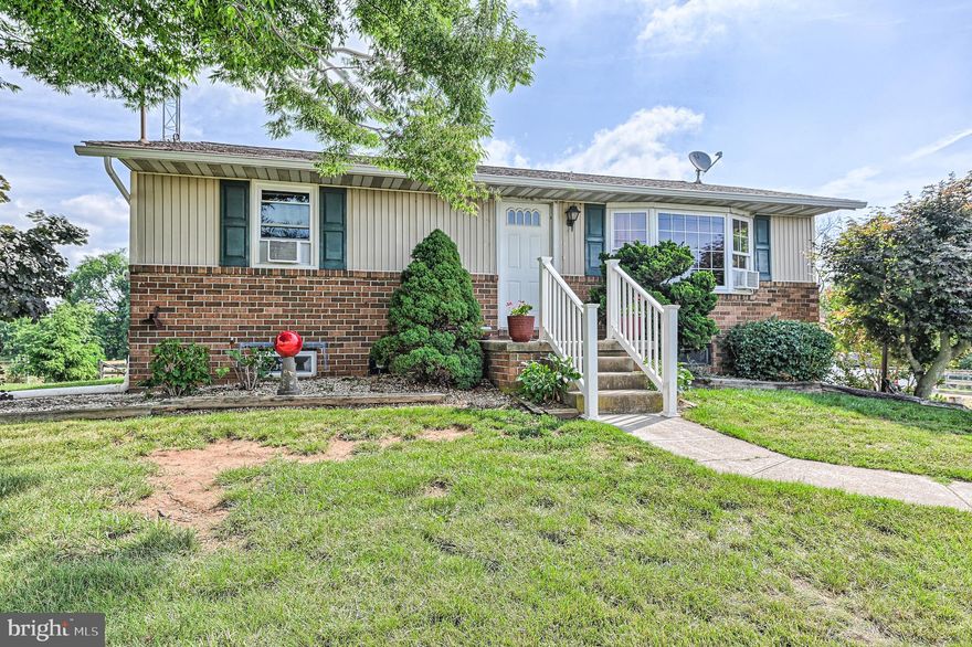 Very nice farmette with 3.86 acres of land and lovely views! The property boasts a cozy home with a one car garage, barn , shed, and fenced pastures.  The property consists of 2 parcels; one parcel contains the house and the barn with approximately 1.86 acres, while Parcel number 2 contains 2.0 acres.  A good portion of the property is fenced.  There are 3 stalls and a tack room in the barn.  On the first floor, the home has 2 bedrooms, bathroom, living room, kitchen, and dining area.  The lower level has a cozy family room and another finished room which could be used as bedroom #3 or as an office.  The laundry room and garage are also located on the lower level. The home is not located in a flood zone, but the tree lined portion at the rear and east side of the property is located in flood Zone A.