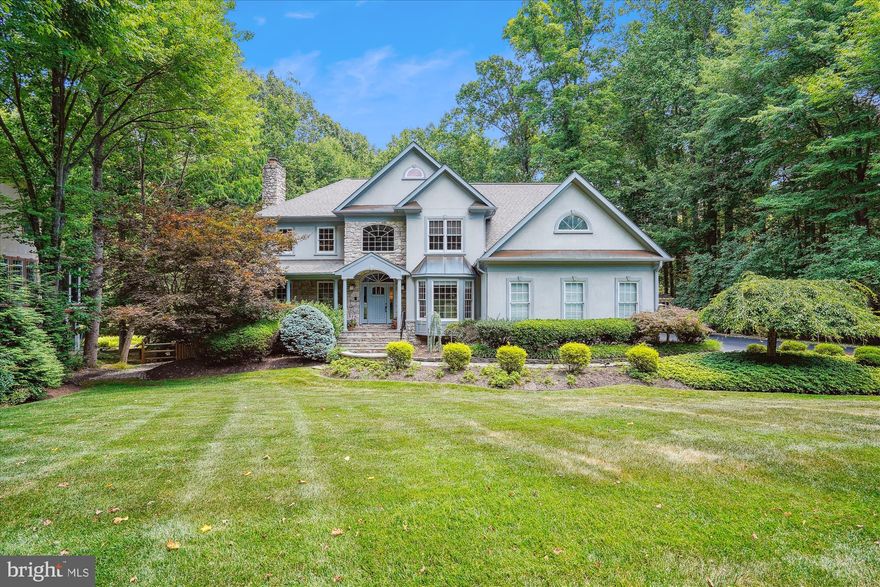 Your search has ended!  This one "checks all the boxes".  Breathtaking home, sheathed in stucco and stone and updated to perfection , on a leafy .7 acre in sought after Dartmoor.  Roughly 6500 square feet of up-to-the-minute style!  Bathed in natural light throughout, with abundant windows and skylights.  These long-time owners have manicured this property, and the pictures speak for themselves.  It is idyllically sited on a leafy .7 acre, backing to parkland.  A spacious screened porch sits just off the renovated (2021) kitchen with natural cherry Shaker-style cabinetry with stylish glass backsplash and a stunning custom granite.  Enjoy dinner on the porch (built in 2003), your only companions the foxes and deer.  An enormous vaulted-ceilinged family room, drenched in light from dramatic walls of windows and abundant skylights, is wide open to the kitchen.  A second, private family staircase sits off the family room for access to the upper level.  For formal entertaining, the living room and dining room are unusually large and boast abundant windows.  The dining room enjoys a charming bay window opening the room to the green space beyond.  On the other side of the entry foyer is the home office/study with built-in shelving, thoughtfully located away from the bustle of family hubbub.  The upper level presents four bedrooms and three full baths.  The Owners' Retreat is exquisite, with a remodeled bath and two remodeled walk-in closets.  The bedroom itself boasts two walls of windows.  A second bedroom also features its own private bath and two others share a buddy bath, one of them enjoying a built-in desk.   The walkout lower level, floored in wood-like luxury vinyl plank, features a generously sized rec room with a stone clad gas fireplace.  It also enjoys a fifth bedroom/in-law suite, comprised of a large bedroom and a sitting/TV room.  A stylish wet bar sits just outside the bedroom suite, suggesting its suitability as a kitchenette for an in-law or live-in nanny.   The entire level opens to a patio, and the in-law suite enjoys its own private entrance.  Updates are many, to include a new 50-year roof in 2021, furnace 2023, HVAC upper level 2020, water heater 2024, garage doors 2024,   all 3 upper level baths 2024, primary bedroom closets 2024, screened porch heating 2020, lower level in-law suite with separate entrance 2016, rear yard fencing 2021, added screened porch 2003, replaced EIFS with real stucco 2003, finished lower level rec room and wet bar 1998.  Absolutely no detail has been overlooked.  Navy, Franklin, Oakton HS pyramid.  OPEN SATURDAY AND SUNDAY 1 to 3.