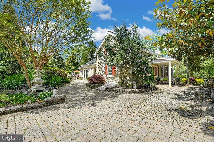 Only rarely does a perfect blend of history, location and buildings of fieldstone combine to produce a property such as this. Sequestered down a private lane and located on a quintessential country road, the manicured 5.6 acres invite you to relax and enjoy. A separate guest house and studio create extra space for friends and family. Whether this country home is your full-time residence, or a quiet, weekend getaway, you will be captivated by this historic property and beautiful surroundings. Artistically merging old and new, this 1800’s farmhouse boasts a custom renovation, three car garage with bath and second floor studio/office, and a new barn with fenced pasture … all set amongst fabulous landscaping. A Morris Black kitchen features Viking, Bosch and Sub Zero appliances, skylights and a vaulted ceiling. An arched doorway gracefully leads you from the kitchen into the family room with large windows and a floor-to-ceiling, stone fireplace. The original tavern room, with fireplace and original ceiling beams, is adjacent to a dining room featuring a fieldstone wall. The first floor primary bedroom has an exposed stone wall, fireplace, vaulted ceiling and soothing master bath. Two additional bedrooms and bath complete the second floor. This is truly a property with enduring appeal — a refined country estate just a short distance from Lehigh Valley’s amenities and convenient to Philadelphia in 60 minutes and just 90 minutes to NYC.