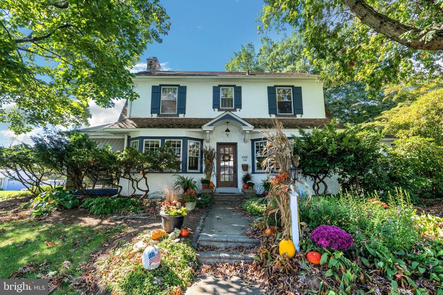 To say this home has been lovingly cared for by the same owners for over 40 years does not begin to explain the love and care you feel once your step into the warm hug of a home that is 100 Davis Ave. A beautiful Dutch Colonial with mature trees, loads of greenery and an idyllic setting. Enter the formal foyer donned with lots of character. To the left of the foyer you'll find the large living room with a wood burning fireplace, built in shelving and access to the covered porch which will surely be a favorite place to spend quality time. To the right of the foyer is the formal dining room flowing into the updated kitchen with radiant flooring. Down the hall from the kitchen you'll find the FIRST FLOOR  primary SUITE or IN-LAW QUARTERS  with large windows overlooking the rear gardens and water feature creating a serene setting to settle into at the end of a long day. This is also an ideal set up for an in-law quarters if needed. Upstairs you will find 3 bedrooms and a full bathroom. The largest bedroom is currently being used as a living space complete with a kitchenette however, it could be reverted back to a primary bedroom as it was when the home was originally built. On the 3rd floor you'll find the walk-up attic space. The attic offers a storage room, large closet, built-in shelves and an area perfect for a 5th bedroom or flex space. Let us not forget the amazing outdoor space filled with mature trees and plantings for every season. To top it off there is a detached garage with driveway parking. Inside the garage you will find ample storage space along with a finished room perfect for an artist space, home office for anything your heart desires. The room/studio has heat and a window air conditioner as well as a whimsical loft area often used as a place to curl up with a book. With so much to offer you'll also find hardwood floors throughout, updated features with a mix of old-world charm, ample outdoor space, and more. 100 Davis is Straight Up Home Sweet Home.