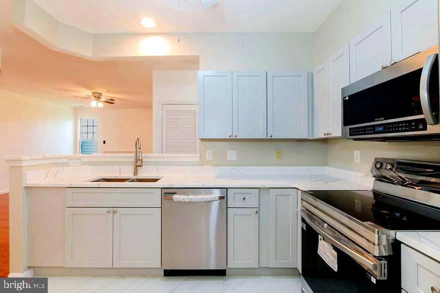 WOW! Don’t miss this beautifully updated 2-bedroom, 1-bath condo in the heart of Windsor Mill!  New appliances!  Freshly painted and move-in ready, this second-floor unit features a fully renovated bathroom with new flooring, tub, and shower surrounds, updated vanities, modern lighting, fixtures, and a brand-new toilet.
The stylish kitchen is a dream with quartz countertops, soft-close cabinets, and stainless steel appliances—all new in 2024—including a microwave, dishwasher, refrigerator, and range. The engineered hardwood floors have been newly refinished, and ceiling fans in the living room, kitchen, and primary bedroom add extra comfort.
Enjoy a spacious living room with a cozy gas-burning fireplace and gleaming engineered hardwood floors. Step out to your private patio, which faces a peaceful wooded area—perfect for relaxing or entertaining.
Major upgrades include a brand-new Hydronic HVAC system and water heater (2024), plus the convenience of an in-unit washer and dryer.
Located not far from Security Square Mall, you'll appreciate the unbeatable location near shopping, dining, public transportation, and major commuter routes. Off-street parking is also included.
Everything you've been looking for—at a price you'll love. Schedule your tour today before it's gone!