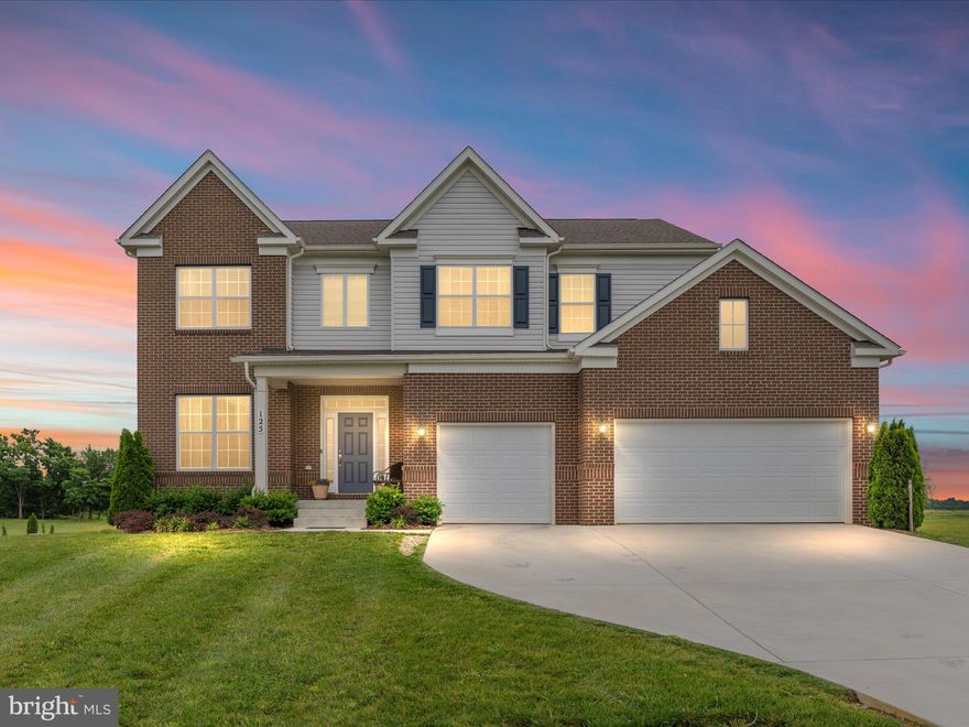 Come visit and bring your offer! Tucked into the wide-open beauty of Jefferson County, this 2022-built home offers a rare blend of refined finishes, flexible living space, and the kind of setting that invites you to slow down and stay awhile. Set on a full acre in the sought-after Harvest Hills community, every inch of this home was designed with comfort, versatility, and elevated country living in mind.
Step inside and feel the light pour through oversized windows as you move through an open, thoughtfully designed layout. The heart of the home — the gourmet kitchen — stuns with a large center island, quartz countertops, stainless appliances, a walk-in pantry, double wall ovens, and a five-burner gas cooktop with sleek hood. The great room offers the perfect backdrop for everyday life and entertaining alike, complete with gas fireplace, a 4’ bump out, and backyard and mountain views that stretch for miles.
With two generously sized bedroom suites — one on the main level and one upstairs — you’ll find flexibility and comfort for a variety of living needs. The upper-level suite feels like a true retreat, featuring a spa-like bath with tall double vanities, quartz countertops, upgraded tilework, a frameless glass walk-in shower, and a spacious walk-in closet.
Four additional bedrooms upstairs — all with their own walk-in closets — are complemented by a versatile loft space perfect for a second living area, home office, playroom, or creative studio. The upper-level laundry room with linen closet adds convenience to everyday living.
Downstairs, the finished walk-up basement is full of possibility. With 9.5-foot ceilings, a full bath, and a massive rec space prepped with a wet bar rough-in, there’s room to gather, create, or unwind. A large, nearly finished sixth bedroom is already insulated and drywalled (ceiling included), and additional storage and a designated workshop area round out the lower level.
Outside, the flat, usable backyard is a true canvas. With the septic system thoughtfully positioned to the side, there’s plenty of space for a future pool, outdoor kitchen, or backyard retreat — ready for your personal vision to come to life.
The oversized three-car garage easily accommodates a full-size pickup and leaves room for gear, tools, or extra storage.
Located just minutes to Route 9 and Jefferson High School — and convenient to Northern Virginia, major commuter routes, the MARC train, shopping, restaurants, and retail — this home offers the perfect balance of connection and calm.
From golden hour dinners under the open sky to cozy mornings with mountain views — this is more than just a home. It’s a place to live fully, dream freely, and stay awhile.