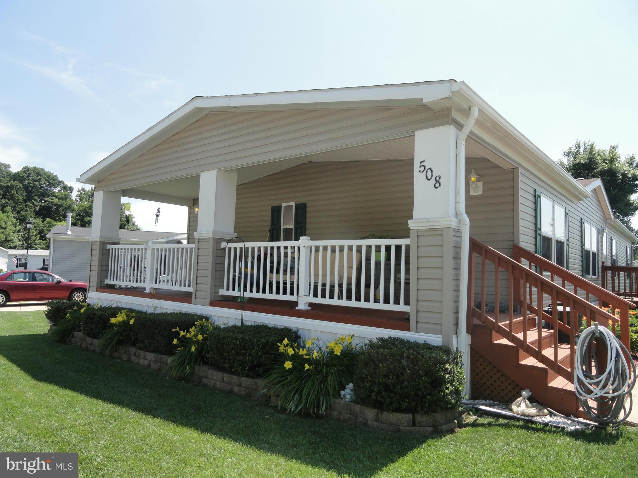 Lovely! Everything you need on 1 floor! Jacuzzi tub in mstr bath/walk in shower(handicap access) 2 car parking/shed/sky lights/natural light/fireplace/Some items may stay or negotiable/2004 Champion/Original owners/64x28/Double Wide/Skirted/Corner lot! All appliances convey! Separate laundry & dining areas--Ground rent is currently $517/month/Great Community Subject to park approval & terms