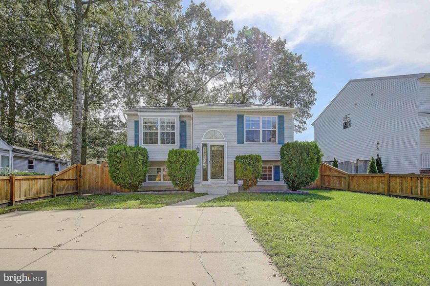 Multiple Offers Received.  Offer deadline 4:30PM Sunday.  Welcome to this meticulously maintained split foyer home on an idyllic street. The first thing you will notice is the curb appeal of this home. Upon entry you will find beautiful hardwood floors and fresh carpet throughout.  The upper level features a large eat in kitchen with recently upgraded countertops.  The living room is flooded with natural light.  There are three large bedrooms upstairs.  The owner’s suite features an en suite bath, and custom closets.  Just off the owner’s suite, you will find a large sunroom which makes the perfect relaxation space.  The lower level has an additional bedroom, a full bathroom, a large rec room and 5th bonus room which makes the perfect flex space.  The basement walks out to a full fenced back yard.  This home features loads of living space and a perfect yard for outdoor entertaining.