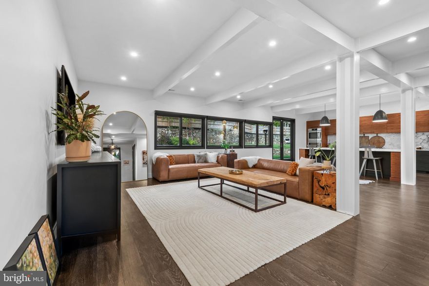 OPEN HOUSE CANCELED FOR 12/20. Please arrange a private showing! Welcome to 3410 Woodvalley Drive, an unrivaled mid-century modern residence where light, design, and craftsmanship come together. In 2018, the home underwent a full architectural renovation, reconstructed from the inside out with enduring comfort and no detail overlooked. Designed for long-term living rather than resale, every feature blends function and luxury. Passive-solar orientation allows winter sunlight to warm the interiors while roof overhangs limit summer heat. Inside features 10-ft ceilings, exposed beams, wide-plank flooring, and full-height interior and closet doors that stretch nearly floor to ceiling, enhancing the home’s vertical lines and airy feel. The chef’s kitchen includes Wolf, Sub-Zero & Bosch appliances, dual ovens, a five-burner gas range with custom hood, quartzite waterfall island, lift-up cabinetry, hidden outlets, and a drawer-style microwave. The primary suite offers two custom closet systems with built-in drawers and shelving, heated radiant floors, an oversized rain shower, ROHL fixtures, his-and-hers vanities, and custom blackout shades. Additional bedrooms have large windows, sliding barn doors, and built-in closet systems. The mudroom/laundry functions as a secondary prep space and butler’s pantry with deep sink, extra refrigerator, and custom cabinetry. Utility features include a full-home water filtration system and a tankless water heater. The 0.63-acre lot features full yard irrigation, original stone retaining wall with steps to the upper lawn, a six-foot custom wood fence (2023), a glass-door two-car garage, and an attached second storage garage. Architectural up-lighting showcases the home after dark. The backyard offers space for future amenities such as a pool or putting green, while preserving open green space. Modern California living, timeless elegance, and thoughtful design all come together here, a home this intentional and refined is rarely available in Woodvalley.