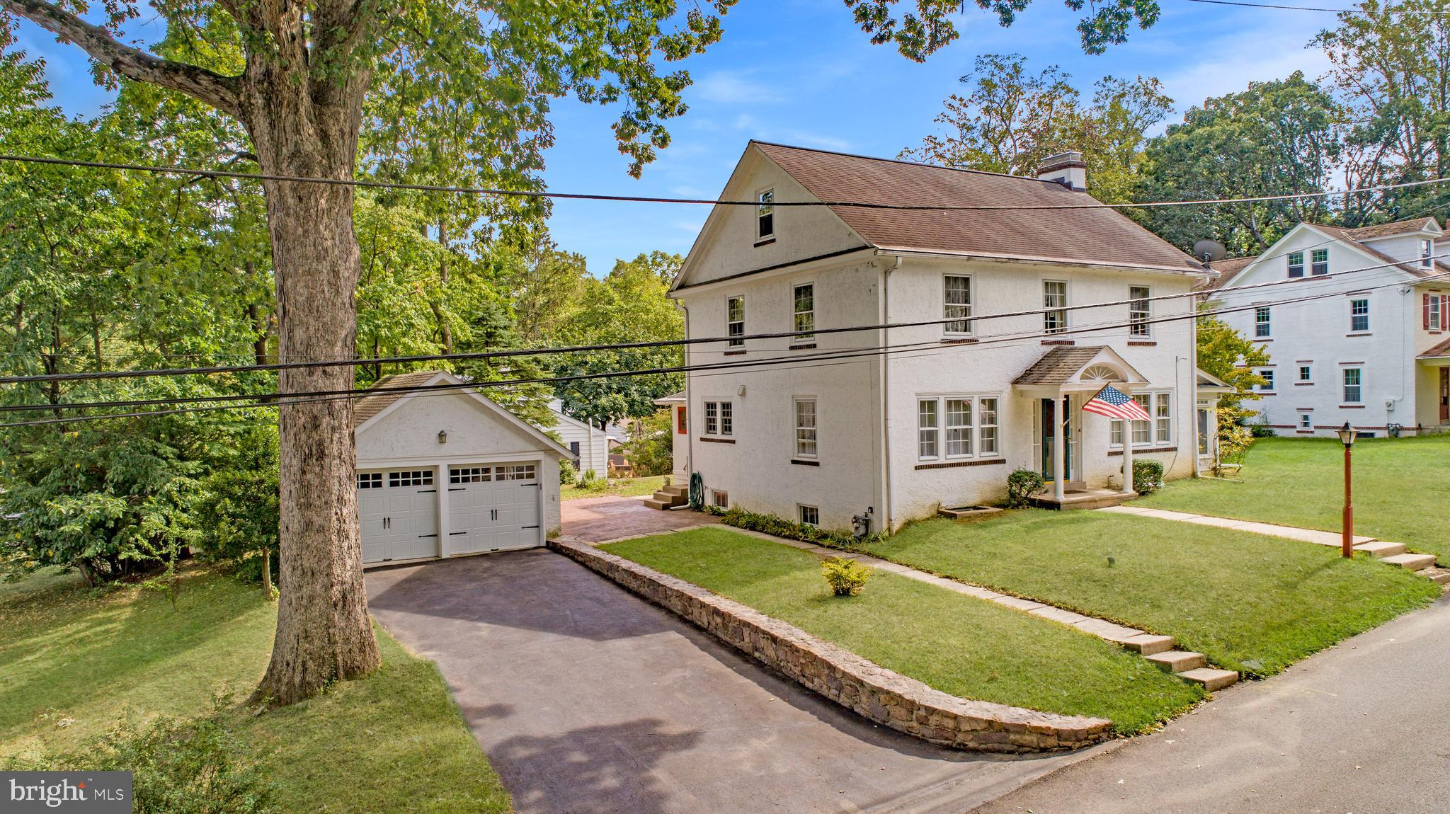 Welcome to this charming 1920’s home in the heart of Berwyn within the award-winning Tredyffrin/Easttown School District.
Enter the main floor to find the dining room on the left and the living room on the right. The living room features built-in bookcases, a brick fireplace, and two sets of double glass doors that open to a sun porch with transom windows. The formal dining room is finished with chair rail molding, while the kitchen showcases cork flooring, 42-inch cabinets with crowns, tiled backsplash, stainless steel appliances, a five-burner gas stove, microwave with convection, recessed lights, pendant lighting, and a stainless under-mount sink. A convenient powder room, laundry room, and bright sun porch complete the main level.
Upstairs, you’ll find four bedrooms plus an office. One bedroom includes built-ins, and three bedrooms — including the primary — feature ceiling fans with lights. A hall bath offers a Jacuzzi tub, and the easy-to-expand walk-up attic with three windows provides potential for even more living space. Comfort is ensured with a Trane system providing central air on the second floor.
Thoughtful updates include a 2017 roof on the main house, a newer roof on the sun porch, Anderson replacement windows in the kitchen and laundry, 200-amp electric service, and attic insulation for improved efficiency.
Additional highlights include a full basement with Bilco doors, gas hot water, and a Weil McLain gas boiler. Outside, a detached two-car garage offers attic storage, two electric doors, new tracks, openers, and gutter helmets.
All of this is just minutes from local restaurants, Trader Joe’s, Handel’s Ice Cream and the SEPTA train station, with classic 1920’s details like hardwood floors, glass door knobs, wide baseboards, mortised locks, and timeless architectural charm adding the finishing touch.
***Don't miss our exclusive website for this home, featuring a 3D Matterport tour, Virtual Reality Walkthrough, detailed floor plan, professional photography, aerial drone neighborhood footage. Note: Some photos have been digitally enhanced.***
