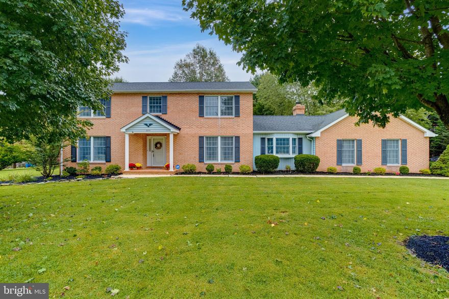 Brick front colonial boasting close to 4,000 square feet of finished space on just shy of 1.5 acres in the heart of Fallston! Through the main door beautiful hardwood floors meet you and span the entire main floor of this traditional colonial. An oversized living room features tons of natural light, wood burning fireplace with brick surround and wood mantel, crown molding and chair rail. The spacious Dining Room is plenty of space for hosting. Into the large eat in kitchen you will find granite counters, a tile backsplash, stainless steel appliances, recessed lights large pantry closet and a breakfast bar leading into your spacious family room. The family room area offers a floor to ceiling brick surround wood burning fireplace, vaulted ceilings, ceiling fan and sliding doors leading to your rear deck and backyard. The oversized 2 car side load garage entry is into this room as well.  The main level is rounded out with a large laundry/mud room and powder room. Step upstairs into your primary suite complete with dual closets, including one walk in closet, ceiling fan, and a primary bath with an oversized tub/shower. 3 additional generously sized bedrooms sit upstairs, all with fresh carpet, double door closets and tons of natural light. A second hall bathroom offers an oversized tub/vanity area with separate shower/water closet area making getting ready with multiple people at once a breeze! Head downstairs to your fully finished lower level where you will find a huge rec room built for entertaining complete with cedar closet storage, a large custom built bar area with recessed lights and built ins, and a wood burning fireplace atop a brick landing. Around the steps you'll find a large game room with pool table that can be left with the home. Behind the game room you will find a large finished room currently being used as a home gym. Storage needs? No worries, there is a concrete floored crawl space underneath the upstairs family room offer tons of storage options! Out back you will find a large, flat, tree lined yard with plenty or room for your outdoor entertaining needs. A large shed with garage door entry, and double side doors, with electric sits in the back corner of the property as well. Schedule your tour today of this beautiful home!