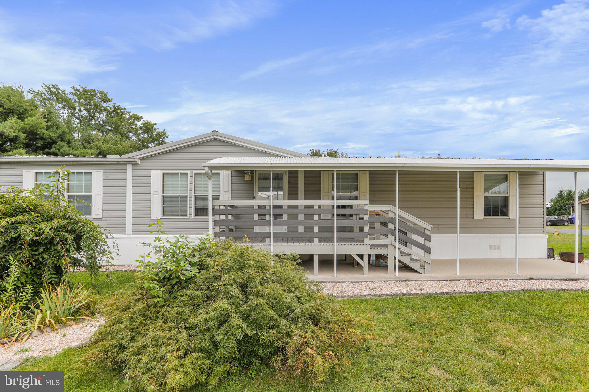 2007 Champion mobile home situated on a rented lot.  Features 3 beds, 2 baths, galley kitchen, hardwood floors, and family room with a fire place!  Enjoy quite nights outside on the front deck with awning.  All appliances convey.  This home has so much to offer!