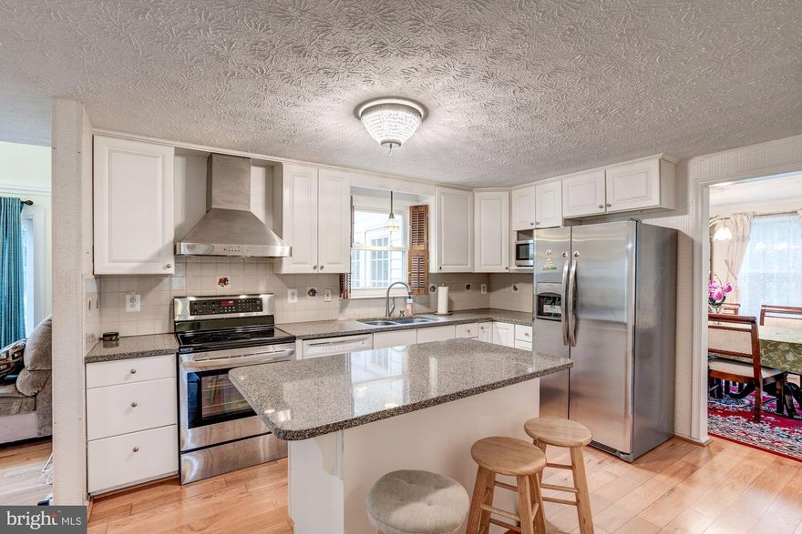 Just reduced by $25,000 and listed $62,000 under tax assessed value. Nestled on a quiet cul-de-sac and exceptionally convenient to route seven, Tysons corner and the Greensboro metro station. As you walk into the main foyer you are greeted by a vaulted ceiling, which lets in an abundance of natural light. Harwood floors carry throughout the formal living room, formal dining room, kitchen and family room. The spacious formal living room is large enough to comfortably fit a baby grand piano along with additional furniture and opens to a large formal dining room with beautiful architectural details such as a chair rail and crown moldings. An airy and bright sunroom off of the formal dining room has six double hung windows and French doors that flood the space with natural light. Beautifully appointed kitchen with granite countertop and island opens to a large and bright family room. The family room has a spacious vaulted ceiling and sliding glass doors, which allow a wealth of sunlight into both the kitchen and family room. Off the kitchen and center hall is a large study that could double as a playroom with glass door, which can be seen from the kitchen. You will not find any carpet throughout the upstairs. What you will find are four large bedrooms, three full bathrooms, three linen closets and a laundry shoot to. Fifth bonus room upstairs could be turned into a legal bedroom or could be expanded into a larger master dressing room. A magnificent master bedroom with private master bathroom and large walk in closet is a purchasers dream come true. A large deck surrounds the entire rear of the home and opens to plenty of outdoor space in which to entertain and enjoy.