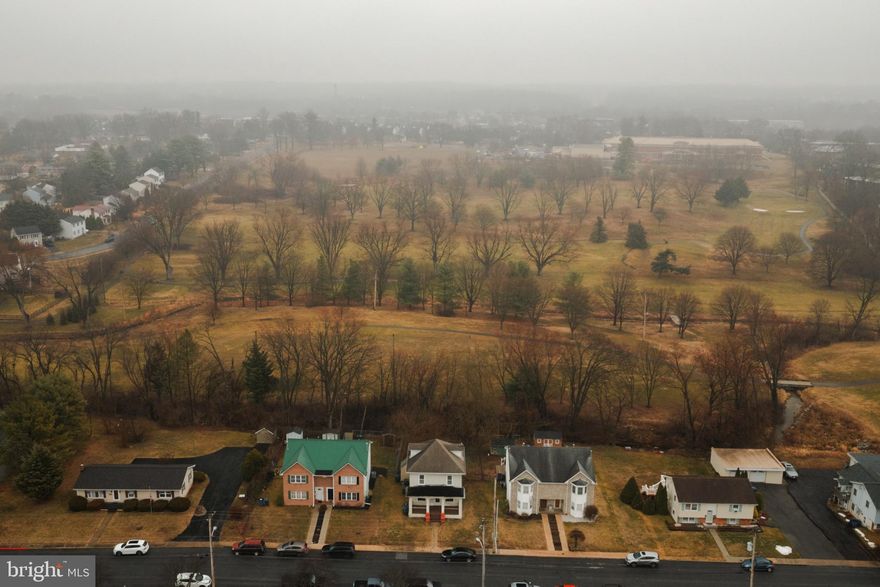 Spacious, updated, and perfectly positioned. This beautifully remodeled Colonial backs to a peaceful stream and offers gorgeous views of Yingling Golf Course, all while sitting directly across from the Senior Center. Inside, you’ll find extensive updates throughout, including fresh paint, a renovated kitchen with granite countertops and stainless steel appliances, and updated full bathrooms on the first. The home offers generous living space, plus a finished attic perfect for a 4th bedroom, office, or rec room, along with the convenience of second-floor laundry. Enjoy the outdoors with a covered front porch perfect for spring mornings, a second-floor rear porch, and a fully fenced backyard ideal for evening bonfires beside the stream. With 2-zone heating and cooling, great size, beautiful updates, and incredible golf course views, this home offers space, comfort, and lifestyle all in one. Book your tour today! (Updated electric panel 240 amp)