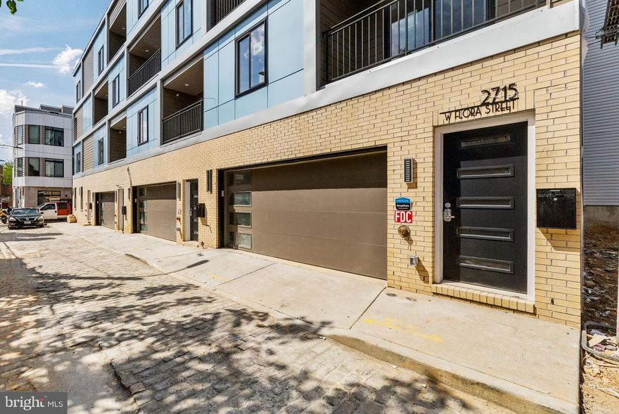 Introducing 2717 W. Flora Street! This luxury, new construction home impresses immediately with two-car garage, elevated finishes, and unparalleled views of Center City Philadelphia. On the entry level, 9 foot ceilings dominate the oversized two-car garage, storage closet, and interior foyer. Don’t miss the electric vehicle charging station!

On the main level, oversized windows and the first of three outdoor spaces greet you. The southern exposure of this home immerses the residence with year-round natural light. The floating stairwell with glass partition brings light into the hallway and elevates the entire lived experience. Hardwood floors throughout living areas. Upgraded kitchen with shaker white or gray cabinets, calcutta quartz countertop, and Cerrad porcelain white tile backsplash. Oversized living and dining area. Tiled powder room on the main level for convenience.

The second floor is dominated by the primary bedroom suite, and you'll love the laundry at the top of the stair for convenience.  Ample room for a king-sized bed, big walk-in closet as well as a secondary closet, and a decadent primary bathroom with water closet, double vanity, walk-in shower, and soaking tub. Even better, there’s a private, second balcony in the bedroom as well!

Three additional bedrooms on the third floor. Each room could serve a myriad of uses: guest or household bedroom, nursery, home office, or even home gym. Full bathroom with double vanity and shower/tub. 

Incredible Center City views from the 23-foot wide roof deck. It’s great in the daytime and even better at night. A short walk to Fairmount Park, Athletic Square, and around the corner from The Boozy Mutt and  Crime & Punishment Brewing Company. 

Ten year tax abatement. Quiet street. Be confident of completion in April 2025. Visit an open house this weekend or schedule your private showing today!