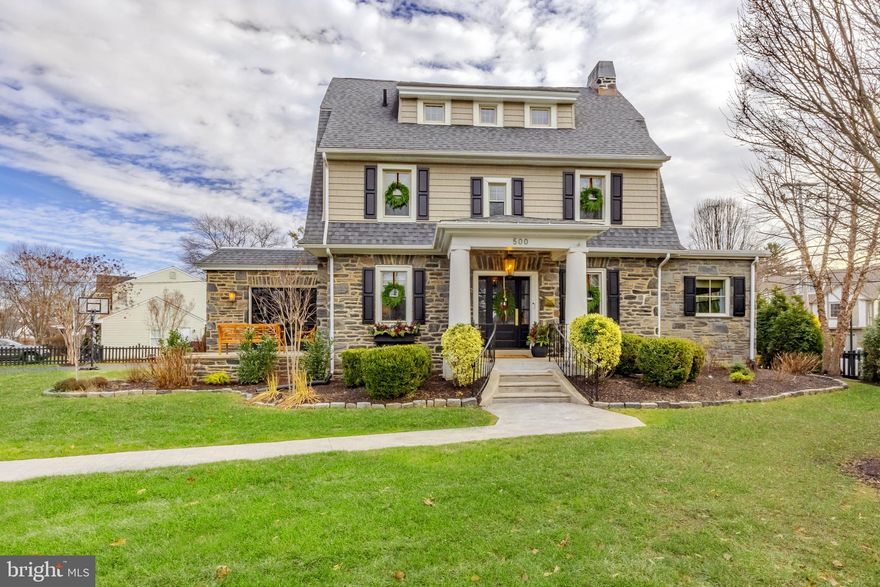 Nicknamed “The Brookline” because it’s the gateway to one of Haverford Township's most cherished, walkable, & historic neighborhoods.  This very special 6 bedroom, 3 full, 2 half bath home has been loved & thoughtfully updated by its current owners from top to bottom.  Each room offers a surprise, whether it’s custom built-ins, beautiful lighting, large windows & trim work details, or just a great view of the neighborhood.  The floorplan is unbelievably versatile, with a phenomenal 3rd floor, a partially finished basement, & large room sizes.  Pull up & fall in love with the professionally planned landscaping, the Wissahickon Schist stone, 100-year-old Belgian blocks bordering the front gardens (unearthed on the property), stately front entry & the oversized private driveway.  Your guests will follow the walkway through the gate & enter at the covered front steps with original pillar detail & step into the foyer entry.  The first floor has a phenomenal circular flow to include so much living space for every day life & for hosting the best parties ever!  The living room was recently updated with custom built-ins designed to look original, offering storage, visual comfort lighting, & a bay window with custom window seat, the perfect spot for morning coffee & rainy afternoons.  The formal dining room, with its original french doors & wainscoting is ready for your dinner parties.  The exceptionally large kitchen has a great breakfast room nook, Carrara countertops, upgraded appliances, a large center island for storage/seating & two very large pantry closets.  The mudroom has custom built-ins for daily life as well as a wall of cabinetry & a Carrara counter that is a perfect bar set up for hosting including a beverage refrigerator. The mudroom door leads you to the back bluestone patio & extremely private backyard which has been thoughtfully landscaped creating a sanctuary for you & your family.  The first floor has a large office space with built-ins, & it’s right off a hallway called “the gallery” which is a fun space to decorate for holidays.  The laundry room is amazing with a tile floor & tons of built-in shelving offering the perfect space for added storage.  The family room also features a custom built-in with a new gas fireplace.  The powder room has custom trim work & is perfectly tucked away.  Upstairs on the 2nd floor you’ll find a very large primary suite with a large bedroom, 2 walk-in closets  & a recently renovated bath with new Calcutta marble tilework, double vanity, large shower with niches & toilet closet.  Also on the 2nd floor are two more bedrooms & a hallway bath.  The 3rd floor offers 3 more bedrooms, a full bath & a large walk-in closet that is perfect for holiday & seasonal decor- it could also make a great office.  The partially finished basement has a great industrial vibe, a half bath & 2 additional rooms for utilities & more storage space than you’ll know what to do with!  The flow & space of this home can easily accommodate multi-generational living, an au pair, or the need for multiple offices & bedrooms.  The property itself is a large corner lot & the home is perfectly situated.  The entire property has been strategically landscaped & fenced and is extremely secure & special.  The backyard is fully fenced, great for children & dogs & offers tons of privacy. There is so much green space on the Oxford Rd side, which is where the driveway is as well.  Brookline is known for its beautiful old homes, each as unique as the next & the ability to walk to Havertown’s beloved attractions like the shops & eateries on the Blvd such as Centrella’s, The Bookery & McGillicuddys. Several schools  & parks are nearby. Walk up to festivals along Darby rd & the Boulevard as well as a quick walk to public transportation. There is no other home quite like this one due to its size, stature & one of a kind appeal.