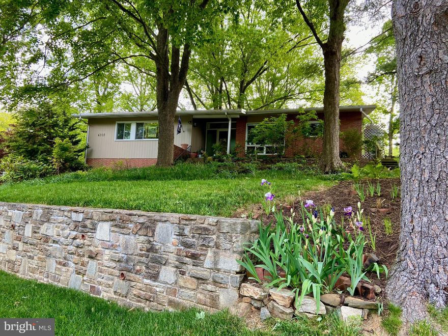 Rarely available Mid Century Modern home in beautiful, wooded, Mt Washington. 
Photos will be up Friday, showings will begin Friday afternoon. *****
This gorgeous home situated on top of " Pill Hill" is one of the five original homes built in 1957.  Mid Century details include the large slate entryway, a gorgeous built in floating teak wood buffet in the dining room, several other original built in shelving units, and last but not least, the stacked stone wall fireplace, which has been converted to gas, with room for a 12' tree right next to it!  *****
 The sellers designed the kitchen to please the pickiest Top Chef!  The custom cabinets were matched to the original wood in the original built ins for a seamless flow. The kitchen features a moveable custom storage island that can completely tuck away into the wall cabinets or be moved out for additional prep/ serving space. The dining room connects to the kitchen for open concept entertaining and has the most beautiful sunset views out of the large picture window. *****
 A four season room with walls of glass was added to the rear of the home off the formal living room, and enjoys views of the large fenced yard with pond and mature trees. *****
Four bedrooms are on the main level along with a large hall bath with a double vanity and a private en suite bath for the main bedroom. All of the bedrooms rooms have closets and receive lovely light throughout the day. The smaller bedroom is currently set up as an office and has really cool vintage shelving and built ins that will convey if the buyer desires them. *****
 The lower level is partially at grade, it's not all below grade. You can enter the lower level from the connecting staircase from upstairs or, from the TWO CAR GARAGE. The 21 x 18 lower level family room is a walkout and has a wall of windows. In the hallway is a generous half bath that is large enough to be converted to full bath.  There is a small storage room in the hall that is being used as a pantry for home canned goods and an additional finished 9 X 10 bonus room that is currently used for the wine collection or could be a cozy home office. In addition, the large unfinished storage area has room for a workshop or crafts and the laundry. *****
 In summary, bring your martini glasses and relax in your new , cool, vintage home! Don Draper might stop by, who knows?