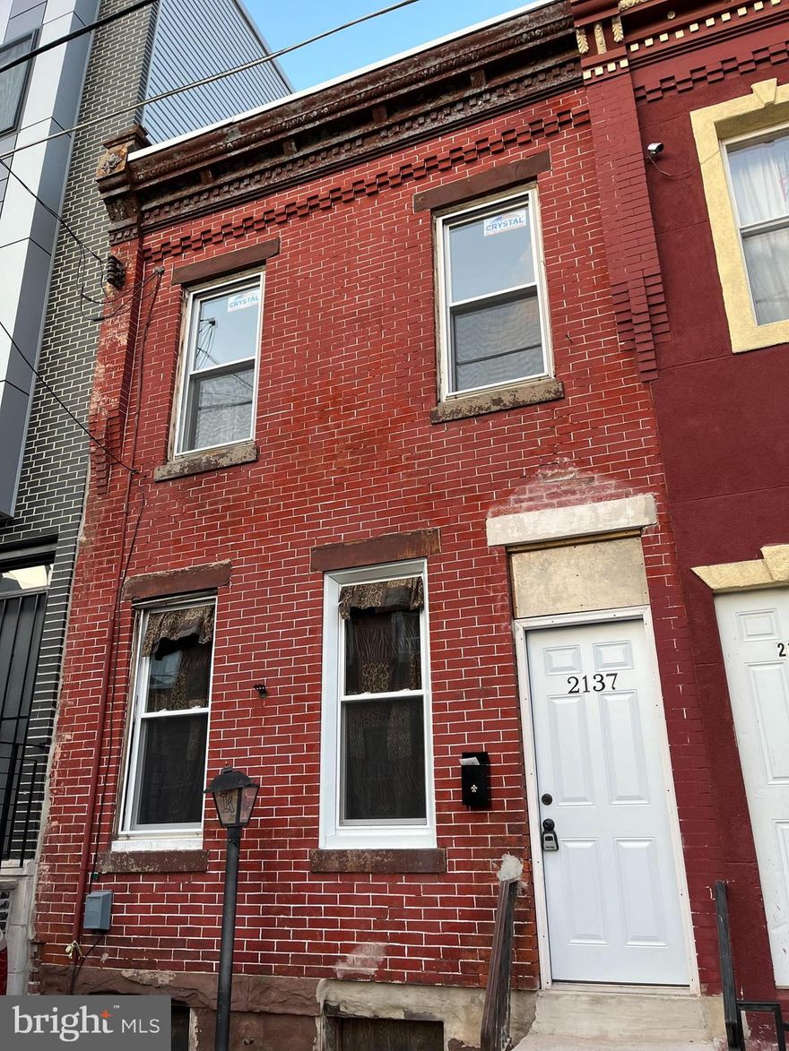 Totally renovated 2 bedroom straight-thru situated on a quiet block surrounded by new construction in developing area of Port Richmond.  Enter to find newly installed laminate hardwood flooring and fresh paint throughout.  The main level offers an open concept with a living room & dining room combo, both of which have ceiling fans.   The rear of the home has a dream kitchen complete with all new shaker cabinets, an abundance of granite counter space with subway tiled backsplash, all new stainless steel appliances including gas range, built-in microwave, refrigerator that is included and exits to the private rear yard that is great for BBQ’s and entertaining.  The upper level hosts a spa-like bathroom with beautifully tiled stall shower with shelving, ceramic tiled floors, new vanity, and toilet as well as 2 spacious bedrooms that both have ceiling fans.  The lower level offers a laundry area with washer & dryer that are included and plenty of room for storage.  Will not disappoint.