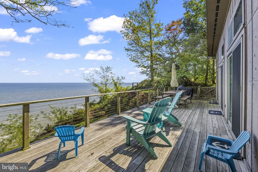 1928 Elm Rd in Port Republic, Maryland is a perfectly updated, turnkey waterfront getaway located in the highly desirable Scientists’ Cliffs community. This home is being sold fully furnished and move-in ready, making it ideal for a weekend retreat or low-maintenance second home. The interior has been thoughtfully modernized while keeping the warm, coastal charm that makes bay living so inviting. Just steps from the property, you have immediate access to wide sandy beaches, which is rare in Calvert County. Spend your days relaxing by the water, launching a kayak, or exploring the outdoors. Scientists’ Cliffs is known for its natural beauty, rich history, and strong sense of community. Residents enjoy direct access to all 26 miles of ACLT (American Chestnut Land Trust) hiking trails, allowing you to immerse yourself in preserved forest and stunning views without ever leaving the neighborhood. 
This property combines turnkey convenience, waterfront living, beach access, extensive amenities, and a vibrant community setting that is hard to find anywhere else. 1928 Elm Rd delivers the perfect blend of relaxation, recreation, and natural beauty in one of Southern Maryland’s most unique and treasured neighborhoods.
The community offers an incredible range of amenities including a swimming pool, toddler splash pool, tennis and pickleball courts, basketball court, sports field, playground, and beach with a boat ramp. There is a Community House with free summer camp programming, planned social and holiday events throughout the year, and the historic Chestnut Cabin event space. Practical conveniences are also included such as garbage and recycling pickup twice a week, monthly green trash pickup for yard debris, snow removal and road maintenance, community water supply with no separate water bill, and dedicated boat and RV storage. Community gardens and beautiful walking trails add to the peaceful lifestyle.