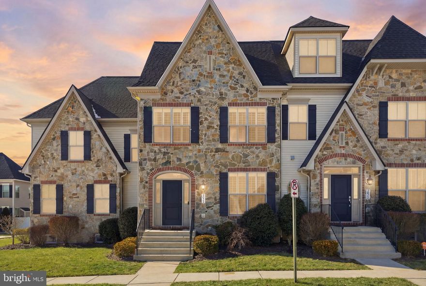 Pleased to present this fabulous Wormald Chateau Amboise model in the coveted neighborhood of Wormans Mill. It has a stunning stone front elevation with welcoming front porch accented by modern shutters. Upon entry you will notice the hardwood floors throughout, 9 ft ceilings and bright natural light filling each room. Beautifully upgraded and updated for elevated living, this home is ready for you to move in. The formal living room has built in bookshelves for your perfect library or displays. The gourmet kitchen offers granite counters, kitchen island, bar seating, open shelving and stainless steel appliances. Proceed into the family room with gas fireplace, recessed lights and door to back patio, perfect for entertaining. On the upper floor you have a gorgeous primary suite with full bath & walk in closet. This floor is completed with the spacious laundry room along with the secondary bedrooms and full hall bath. That's not all! The completed full finished basement has a recreation room and bar, den/guest room and full third bath and plenty of storage. Minutes to shopping, major commuter roads, schools and public transportation and numerous neighborhood amenities for you to enjoy all year long! Don't miss your opportunity to be part of Mill Island.