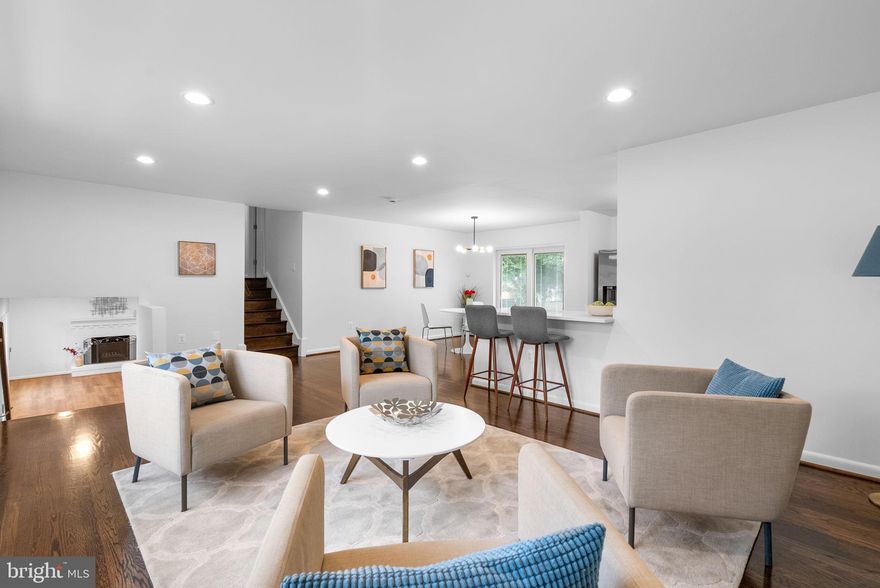 Beautifully renovated 5-bedroom, 3-bathroom split level.  Owned solar panels (no cost).  Step into spacious comfort with this beautifully refreshed split-level home offering 5 bedrooms and 3 full bathrooms across multiple levels of living.  The entry level welcomes you with a versatile family room anchored by a cozy wood-burning fireplace, along with a bedroom - perfect for guests or a home office - a full bathroom, and a finished laundry room.  Upstairs, sunlight fills the open-concept living and dining areas, where gleaming hardwood floors flow seamlessly into the modern kitchen. Designed for both style and function, the kitchen features new soft-close cabinetry, quartz countertops, stainless steel appliances, and direct garage access. A walk-out patio extends your entertaining space into the backyard oasis.  On the upper bedroom level, the spacious primary suite includes a private bath, complemented by three additional bedrooms and a full hall bathroom.  An unfinished lower level provides abundant storage or room for future expansion.  Ideally situated just minutes from major commuting routes and Joint Base Andrews, this home blends modern updates with everyday convenience.  Owner is a licensed Realtor.