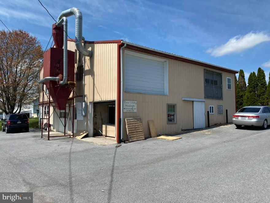 This is a 4,000 sq. ft. building formally used as a wood shop. First floor has paint booth and numerous other rooms including a finished office space. Upper level is open with a concrete floor. Dust ventilation system included. Elevator from 1st to 2nd floor.