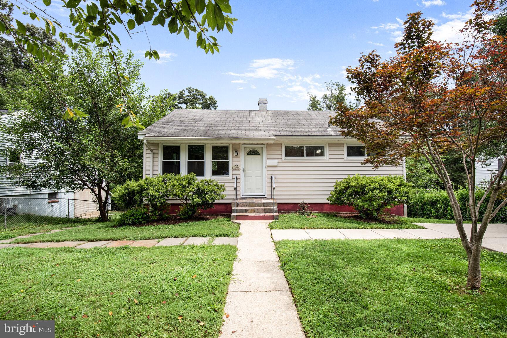Radiant and Relaxing in Rockville! This 4 bed/2 bath rambler features stunning hardwood floors, an updated kitchen, and a versatile lower level perfect for entertaining. Enter into a bright and open living area leading directly into the gourmet kitchen, which includes SS appliances, quartz counters, and a subway tile backsplash. The main level also includes 3 spacious bedrooms and a full bath with tub shower. The versatile lower level includes plenty of space for entertaining friends and family and a bedroom and full bath for guests. Relax and unwind in the oversized, fenced rear yard, which also includes a storage shed. Perfectly located seconds to Twinbrook Metro, Rockville shopping/dining, and major commuter routes. Vouchers welcome.