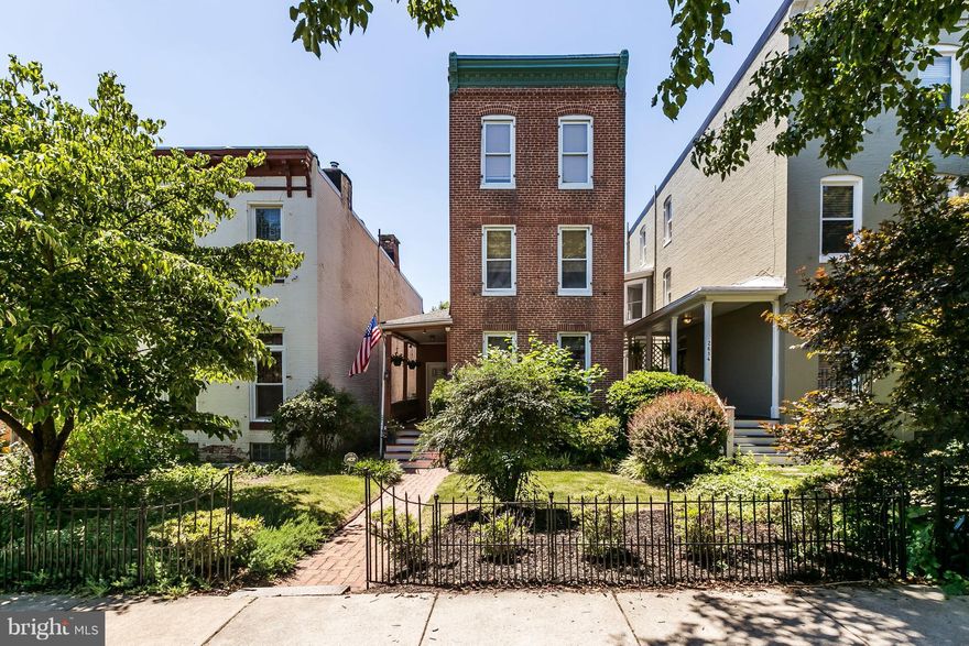 Rarely available DETACHED home w/ PARKING in Charles Village! Historic touches everywhere: original hardwood floors throughout, exposed brick, parlor, fireplaces, & formal dinning room. Master bed has en-suite bath w/ dual vanity sinks, sep. tub and shower. 3 more large bedrooms upstairs, each w/ HW flrs. Dual zone heat & A/C. Huge fully fenced backyard w/ parking, hardscaped for e-z maintenance.