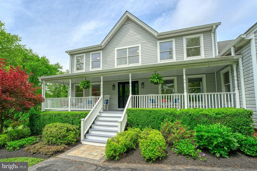 Stunning Renovated Home on 14 Serene Acres in Western Loudoun
Enjoy the perfect blend of privacy, convenience, and natural beauty in this fully renovated home situated on 14 peaceful acres—7 wooded and 7 open—abutting the W&OD Trail. Ideal for walking, biking, and exploring, this property offers a storybook setting with beautiful vistas, mature trees, and open fields, all just around the corner from Route 7, Leesburg, Purcellville, shopping, wineries, and everything Western Loudoun has to offer.
As you enter the property on the tree lined driveway you will be greeted by a new front door, inviting front porch, brand new siding, flowering mature trees and landscaping. The completely remodeled kitchen boasts custom soft close cabinetry, quartz countertops, stainless steel appliances, an induction stove, and expansive windows that showcase the stunning views. The open-concept main level also includes a dedicated study, formal living and dining rooms filled with natural light, and a two-story family room with a floor-to-ceiling brick fireplace, exposed beams and walls of windows overlooking the yard. The glass doors in the family room open to the covered custom deck with trex decking offering fabulous panoramic views, perfect for morning coffee or evening relaxation. A full bathroom is also located on the main level providing an option for a main level bedroom.
Upstairs offers five spacious bedrooms, a loft, brand new carpet and two fully renovated bathrooms. The primary suite includes a luxurious bathroom with a new double vanity, quartz countertops, custom tile, updated lighting, and a separate dressing area with custom counters, custom lighting and backlit mirror. The secondary bathroom has also been fully remodeled with high-end finishes.
The walk-out lower level includes a one-bedroom apartment with a kitchenette, den, private entrance, and separate living space—perfect for guests, rental income, or multigenerational living. The remaining basement area is expansive and ideal for storage or future finishing.  A large two story shed in the yard is spacious enough to park two tractors on the main level, with ample storage space above.  Whether you need a workshop, hobby space, or additional storage, this structure offers endless possibilities.

Outdoor living is a highlight of this property, with the custom covered trex deck off the family room, a fire pit, a salt water hot tub, and gorgeous mature landscaping. A charming babbling creek winds through the property, creating a peaceful setting for exploration and family fun. Whether you're entertaining or enjoying quiet evenings, this outdoor space offers the best of country living.  

Don't miss this rare opportunity to own a private retreat with modern updates and unmatched access to nature, amenities and convenience.