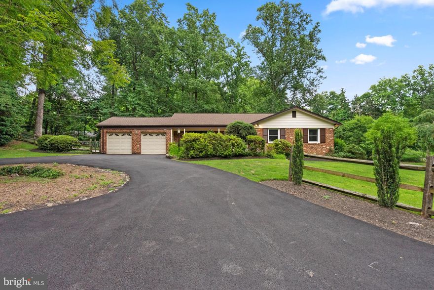 **Offer deadline - Monday at 10 am ** Just listed in North Springbrook - this large mid-century rambler is beautifully situated on a picturesque 1.1 acre lot! Meticulously maintained, this 4-bedroom, 3-bathroom home offers the perfect blend of comfort and functionality. The circular driveway leads to a big brick front patio, through a breezy front porch and into welcoming foyer. To the left is a spacious eat-in kitchen, with high-end appliances, ample counter space, loads of storage and a door to the two-car garage - perfect for unloading groceries. Off the kitchen is a formal dining room with chair rail molding. This opens to a large two-level living room, offering space for all kinds of activities and including a built-in mini fridge. At the back of the home is a wonderful screened porch with both a sitting area and dining area overlooking the expansive lot. There are three ample bedrooms, including a primary suite with two walk-in closets and a private, renovated bath with a walk-in shower and a tub overlooking the backyard. The lower level features a cozy family room with a gas fireplace that opens onto an outdoor patio, perfect for relaxation or entertaining. There’s even a custom-built speakeasy! Complete with wet bar and corner banquette, it's the ultimate space to host unforgettable gatherings. There’s an additional bedroom, a full bath, laundry, storage and workshop space. A whole-house generator means that power outages are never an issue. With loads of space inside and out, this home is a must-see.