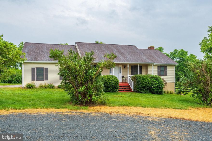 LOCATED ON A SCENIC WORKING FARM, this pleasant 3-Bedroom, 2-Bath RAISED RAMBLER/RANCHER with 2-CAR ATTACHED GARAGE sits on an approx. 33,175 sq ft (.76 acre) oasis with its own private driveway off a paved road.  An inviting FRONT PORCH beckons you to relax and enjoy true country vistas and quiet surroundings.  The very useable FULL UNFINISHED BASEMENT is insulated and has HVAC and SGD walk-out to the yard.  The DECK off the COUNTRY EAT-IN KITCHEN and large grassy yard are perfect for outdoor living.  There are even several raised plant beds for the gardening enthusiast.  Features include:   Primary Bedroom with large ensuite Bathroom;   Hardwood floor in Living Room.    New upgrades in 2022 include:  designer vinyl tile flooring in Country Kitchen and Laundry Rm;   neutral w/w carpeting in Bedrooms and Hallway;   neutral paint;  blinds on all windows;  and  HVAC  (August 2022). 
 **** The imposing basement fireplace with its massive brick hearth and surround is NOT FOR TENANT USE and the lease will prohibit its use as such, as well as prohibit installation/use of a wood stove insert or free-standing wood stove.
HOUSE AVAILABLE APRIL 5.
