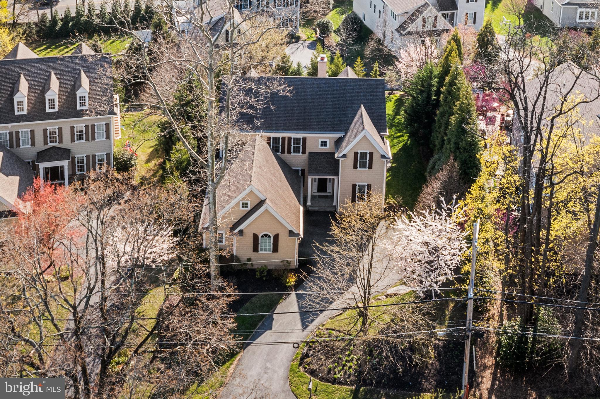 Welcome to 1430 County Line Road—a stunning, meticulously maintained Bentley home built in 2014, perfectly situated on a serene, tree-lined street in the heart of the Main Line. Offering 5,000 +/- square feet of refined living space across three fully accessible levels, this elegant residence combines classic architectural detail with thoughtful modern upgrades. Just minutes from Rosemont Station, Ashbridge Park, and downtown Bryn Mawr, the location balances suburban tranquility with walkable convenience. Sunlight floods the entire home! Step inside to a foyer with rich hardwood flooring, high ceilings, and a sweeping staircase, setting the tone for the home’s sophisticated interior. The formal dining room flows effortlessly into a gourmet kitchen outfitted with stainless steel appliances, custom cabinetry, a large center island, and a cozy breakfast area overlooking the private, professionally landscaped flagstone patio—perfect for relaxing mornings or evening entertaining. A soaring family room with vaulted ceilings and a gas fireplace offers warmth and comfort, while a separate study provides an ideal work-from-home retreat. The Main-Level Master Bedroom is a peaceful haven featuring two large walk-in closets and a luxurious en-suite bath with dual vanities, a soaking tub, and a walk-in glass shower. An Elevator connects all three floors, making every inch of this home easily accessible. Upstairs, you’ll find a spacious Junior Suite with a private bath, two additional bedrooms with ample closet space, a full hall bathroom, and a versatile loft area ideal for a playroom, second office, or lounge. The fully finished lower level expands your living space even further with two additional bedrooms, a full bath, a large open recreation area, a home gym, and abundant storage. Additional features include a first-floor laundry room, first-floor powder room, sprinkler system, custom leaf guards throughout,attached two-car garage, and easy access to Suburban Square and top-rated Radnor District. This exceptional home offers comfort, flexibility, and timeless appeal in one of the Main Line’s most desirable locations. This home is truly one of a kind!