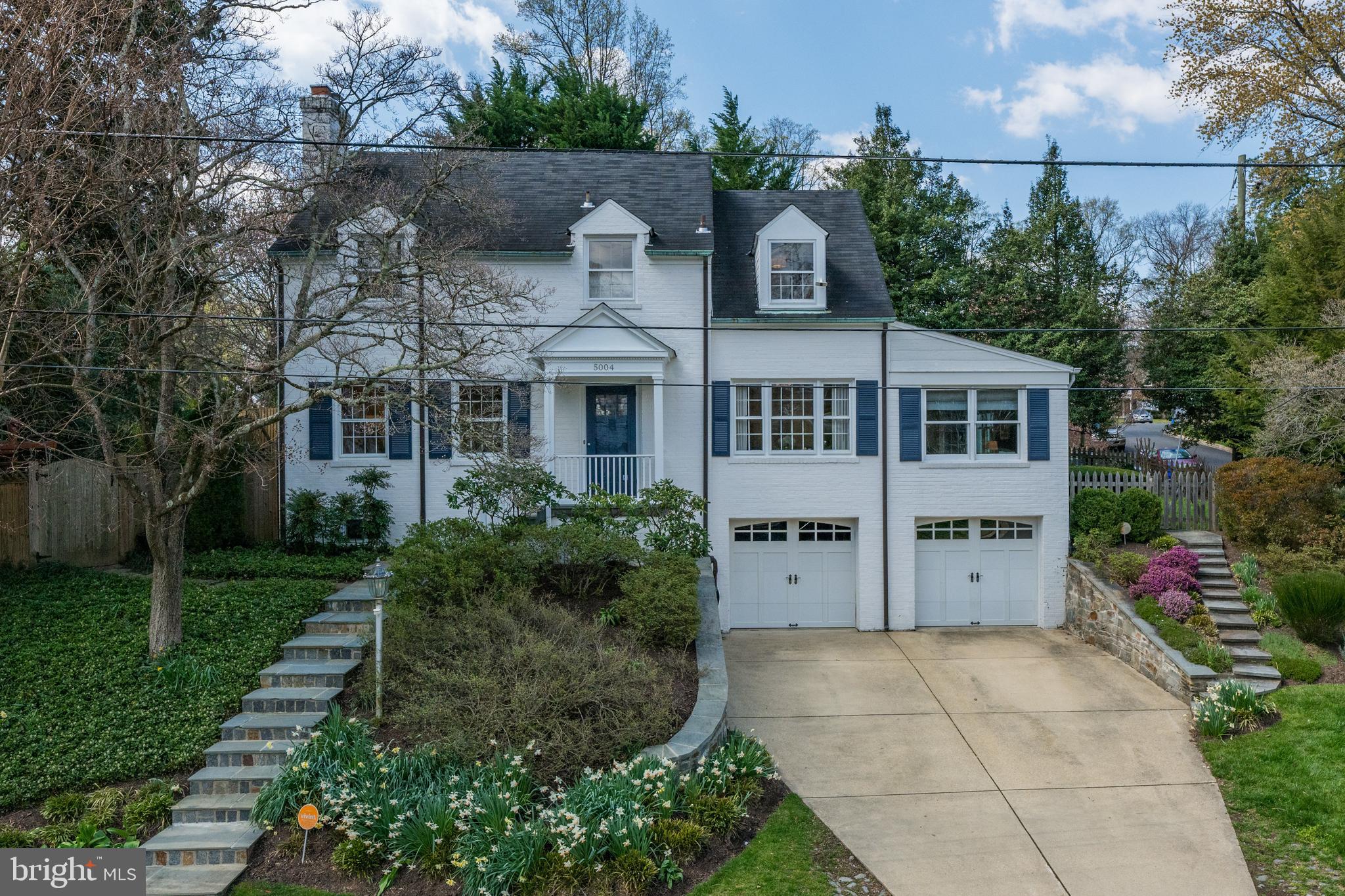 Gorgeously renovated and well-kept colonial in the sought-after Sumner neighborhood just over the DC line in Bethesda. Location provides an incredible mix of quick access to the city, suburban conveniences, nature, and trails for running and biking. This stunning residence exudes attention to detail throughout, with a light-filled open layout on the first floor and smart home features. Offering a formal living room with wood-burning fireplace, gourmet eat-in kitchen with quartzite countertops, Viking 6-burner range/hood and refrigerator, separate dining room, powder room, oversize family room with trey ceiling, and French doors leading to home office and mud room. The second level offers 3 spacious bedrooms and 2 full baths - inclusive of the primary bedroom with en-suite contemporary designed glass-walled shower. The lower level is completely renovated and smartly designed with a large egress window providing the option to create a separate bedroom suite. The basement is lined with closets for storage, has a full bath, wet-bar, laundry room with sink, and utility room. The front-entry two-car garage has plenty of room for your car and custom shelving for bikes, scooters, storage, and more. Enjoy the landscaped picturesque outdoor area, with its flagstone patio for al fresco dining and hosting, and plenty of wrap around yard space for summer activities. The location is prime - 1.5 block walk to the Capital Crescent Trail and Little Falls creek and a quick walk to newly constructed Westbard Square mixed use town center. This address feeds into the following schools: Whitman, Pyle, and Woodacres.