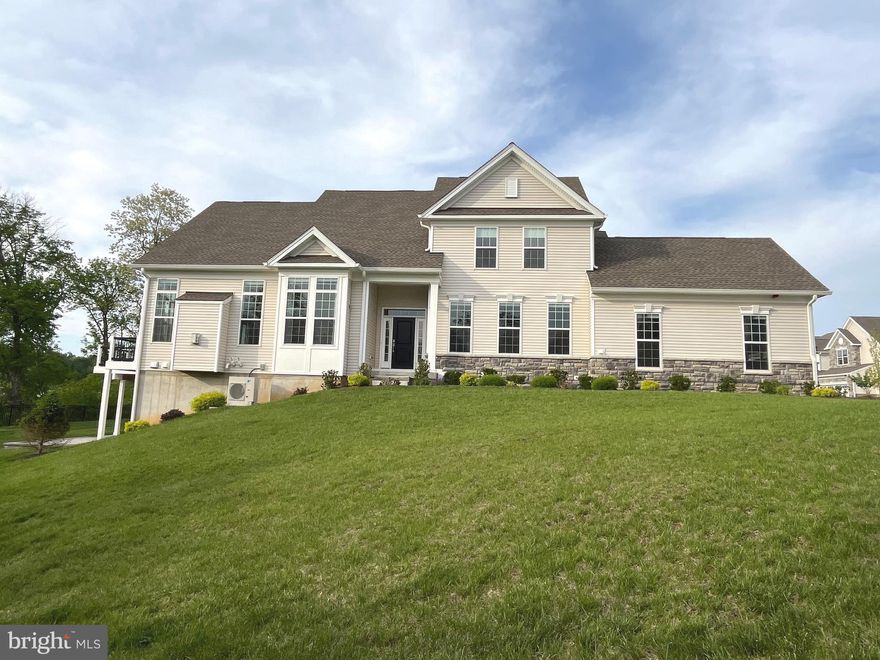 Price Reduced!!! Impeccable, end unit townhome in the highly sought after Darlington Ridge! Toll Bros outdid themselves with the Kinkade Model (very rare) in a premium cul de sac location with breath taking views!  Enter this gorgeous home and notice the engineered hardwood floors throughout the entire first floor, curved stairs and loft! The great room can be configured in many ways and features a gas fireplace, 2 story ceiling and floor to ceiling windows allowing for an abundance of natural light. All windows have custom motorized blinds with remotes! The gourmet kitchen  features quartz countertops, custom tile backsplash, stainless steel appliances  and huge center island! Walk out to the large composite deck, and again a fantastic view of the countryside and neighboring farms! The main floor primary bedroom is perfect size with a tray ceiling and dual, walk in closets with quality custom organizers.  See the  grand, primary full bath with  luxurious shower, dual vanities and privacy toilet! Other first floor amenities include first floor office with glass doors, a mudroom with custom bench seat coming off the 2 car garage and a laundry room with utility tub, cabinet storage  and brand new washer and dryer! 2nd Floor loft  overlooks the great room. There is a princess suite, with a private full bath and walk in closet. The 3rd bedroom shares the hall bath! Both additional bedrooms are good size with barely used neutral carpet and paint! The full basement has high ceilings, and is waiting to be finished. There is rough in plumbing for a full bath. Walk out to a beautiful newer paver patio! The original HVAC was replaced with a zoned Daikin HVAC system and tankless hot water heater.  Other notable upgrades, and there are many, include an extensive lighting package, just tons of recessed lighting and upgraded fixtures. The electrical panel is ready for a generator and there is pre-cabling for an EV charger in the garage and other tech features such as full home ethernet cabling.  Such a well laid out home, in pristine condition,  in the best of locations! $225/month includes common area maintenance, walking trails, lawn care and snow removal! Minutes from West Chester Boro, close to all major roads and great restaurants.  Just a beautiful place to live! Seller has reduced the price for a quick easy sale!