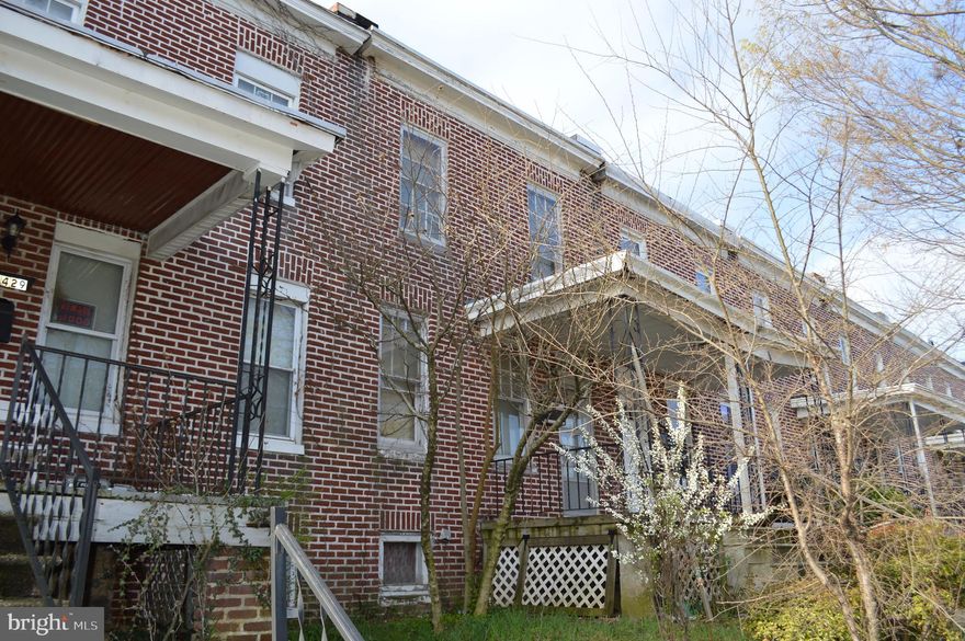 Solid, THS in a long row of homes, brick in front and brick and frame in the back.  Location is between Edison Highway and Belair Road, in the neighborhood next door to Belair Edison.  The first block behind "The Catholic High School of Baltimore".   Also one block from the municipal golf course, "Clifton Golf Course" and one block from "Shoppers Grocery Store", in a large shopping center and one block from a second shopping center called "Erdman Shopping Center".   Two supermarkets within 3 blocks of this home.   Interior of the home needs complete renovation.  Gas fired floor furnace in basement, vents to the first floor and gravity feed to the second floor.  AS IS condition sale.