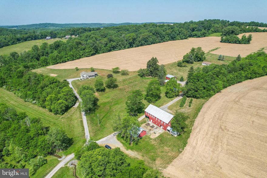 This exceptional farm, set in the heart of Carroll County, offers a perfect blend of serene rural living and productive land. Encompassing 129.21 acres, the property boasts over 40 acres of prime, wooded hunting land, providing abundant opportunities for outdoor enthusiasts and wildlife lovers alike. The 80 acres of fertile, tillable land are ready for agricultural use, ensuring a solid foundation for farming or potential income. Additionally, 10 open acres offer versatile space for grazing, gardening, or recreational use.

The property features two well-maintained homes, perfect for multi-generational living or rental income. Both homes provide comfort and privacy amidst the stunning natural landscape. A meandering stream runs through the property, adding to the tranquility and charm of this picturesque setting.

A large barn, along with multiple outbuildings, offers ample storage space for equipment, tools, and livestock. Whether you are looking for a working farm, a hunting retreat, or a peaceful escape from the city, this property offers a rare combination of features that cater to various interests and needs.

Don't miss the chance to own this exceptional farm with endless possibilities in the beautiful rolling hills of Carroll County!