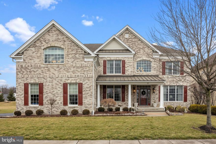 WOW FACTOR! Is the only way to describe this magnificent home! With over 6000 sq. ft of total living space, this pristine home features over $350K in upgrades.  As you enter this beautiful home you’ll fall in love with the open & airy design with spacious foyer entry and dramatic view from the bridge above looking down to the great room below. This lovely home features hardwood floors throughout the first floor, a gourmet kitchen with highlights that include, top end cabinetry with custom trim work, hand selected granite countertops, reclaimed biblical stone backsplash, huge center island, stainless steel appliances, skylight & more. The impressive 2-story great room features a stone, gas fireplace & extra windows for additional light! The formal living room and dining room both offer extensive millwork including crown moldings, wainscoting, and shadow boxing wood trim. Enjoy a cup of coffee in the new light-drenched sunroom or study for those of you who work from home. A beautiful updated powder room and laundry room complete the main level. Upstairs is the sumptuous primary suite with sitting room, 3 walk-in closets & fabulous, updated bathroom. Bedroom 2 is a princess suite with its own bathroom and bedrooms 3 & 4 share a wonderful, updated bathroom.  Downstairs you’ll find a fantastic walk-out finished basement which includes extra ceiling height, den and game room, exercise room, gorgeous full bath with onyx stone shower & slate accents, additional bonus room which could be used as a 5th bedroom, music room, or home office, ceramic tile flooring, recessed lighting & much more.  Outside is an oasis with maintenance-free decking that has an open area for enjoying sunny days and a spectacular, covered porch area that adds so much to the outdoor living experience. The rear yard is completely fenced in and allows for plenty of space to have dogs and play fun games. Beyond the fence is open space that is maintained by the association which adds extra space for play.  Lastly, this home has brick with Hardie plank siding, and the windows and doors have been replaced around the entire house! All this and the award-winning Council Rock School District! Just a few minutes’ drive to highways, great shopping, delicious restaurants, and the best of historic Newtown Boro! The house is ready for you to move right into. All the work has all been done for you!