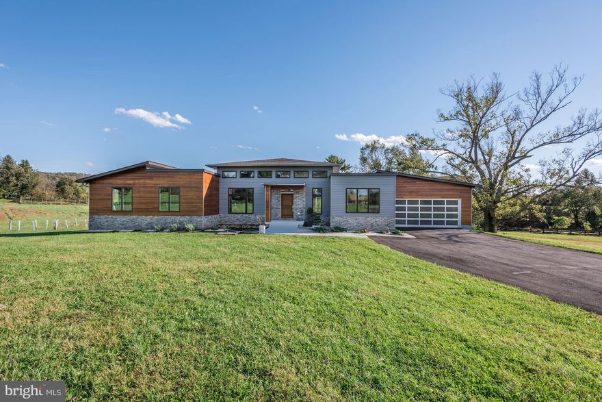 Welcome home to Waterford! This stunning contemporary home has 4 large bedrooms with walk in closets, 3 beautiful full bathrooms and an open floor plan that boasts plenty of sunlight. Enjoy gorgeous hardwoods in the main living area and a gourmet kitchen that will more than meet your needs. Relax on the large rear deck and watch everything nature has to offer on over 4 private and usable acres. With 3 electric fireplaces, 5 modern fans, build in surround sound on the main and basement level and tall ceilings you will quickly feel right at home. The basement offers a ton of entertaining space, large bar, bedroom and full bath. This is a home you do not want to miss!