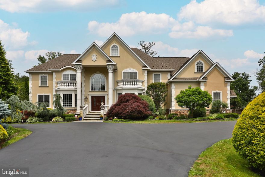 Looking for that private custom built home on a private lot in the Upper Dublin School District? Look no further! Travel down the private driveway to the circular driveway to the show stopper custom built colonial style home situated on over 1 acre of private landscaped grounds. 4 bedrooms, 3 full baths and 2 half baths plus a ton of custom mill work and moldings and plenty of upgrades make this home stand out from the rest. Enter the double doors to the two story grand foyer with radiant heated marble flooring, a curved staircase with a wrought iron railing and gaze upon the hand painted medallion on the ceiling that is home to the  imported chandelier that offers a motorized lift. The center foyer opens to the  formal living room with hardwood floors, a custom coffered ceiling and provides a tremendous amount of natural l light from the extra large bump out of a triple bay window. Across the hall is the formal dining room that also has hardwood floors, a tray ceiling and a bump out triple bay window as well. Connecting the dining room to the large gourmet kitchen is the dry bar area with cherry cabinetry, wine shelf and granite counter tops. Floor to ceiling windows greet you as you enter the chefs dream kitchen that provides a large island with granite counter tops, plenty of mahogany cabinetry, under cabinet lighting, custom ceramic tiled back splash, stainless steel commercial theramdor 6 burner gas cooktop, double Thermador wall oven, warming drawer, Bosch dishwasher, new kitchen faucet and built in refrigerator along with the two story breakfast room and access to the rear staircase and a door to lead outside to the private flat fenced in back yard. Adjacent to the kitchen is an expansive mud room that has numerous closets, a utility sink, an informal powder room and a door that leads out to the attached over sized three car garage. On the other side of the kitchen, the large cozy family room boast large pillars, custom windows, a gas fireplace with a wood mantle and door access to the outside back yard. Next to the  family room, french doors lead into the generous size office with hardwood floors and big windows shedding lots of natural light and tucked away next to the office is a formal powder room with a one of a kind exceptional vanity that is referred as a Louie from France. The upstairs hall way is uniquely wide and opens up to the kitchen and foyer area.  Double doors guide you into the elegant primary suite that displays a tray ceiling , an expansive walk in closet, a sitting room and a luxurious bathroom that has a double vanity with new granite, a soaking tub and an expanded stall shower with multiple shower heads and rain shower. The second bedroom consists of an en suite with a walk in closet custom fitted and a full bathroom, Two more bedrooms with Jack and Jill bathroom and new granite counter tops along with a huge laundry room highlighting a vaulted ceiling and plenty of storage or living space round out the second floor. The finished third floor is the ideal spot for another 800 square feet of additional entertaining space and/or a 5th bedroom. On the lower level, the full  basement, roughed out for plumbing,  is waiting to be finished to allow for more space but in the meantime is wonderful for extra storage and allows access to the outside. Surround sound, upgraded security system, beautiful landscaping around the property, multiple HVAC zones, radiant floor heat on the first floor, new water well, Pella windows all through out are just a few of the outstanding features of this magnificent home. Located in the award winning Upper Dublin School District and close to major highways and public transportation. This is a must see home to fully appreciate the quality and custom features of this fantastic home.