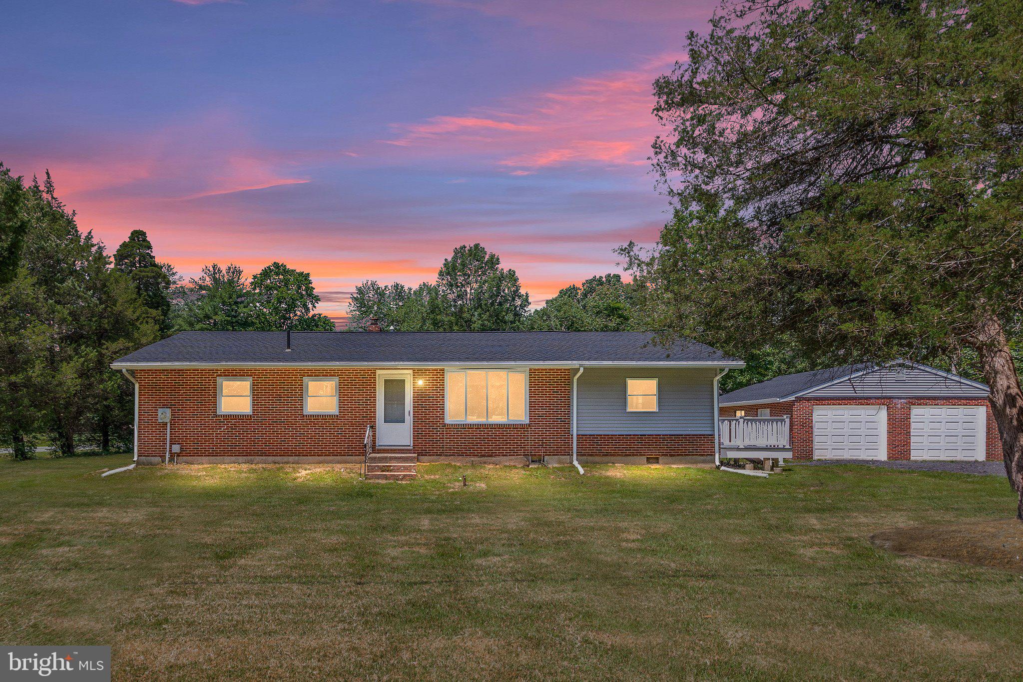 Welcome to 10674 Kasota Rd – Your Tranquil Masterpiece on the Chesapeake's Edge. Nestled in the serene enclave of Chesapeake Landing near Chestertown, this charming 2-bed, 1-bath ranch-style home invites you to reimagine rural living on nearly 0.6 acres of lush landscape. With 1,350 sq ft of one–level living, the brick exterior and detached 2–car garage offers timeless appeal and solid bones with breathtaking updates. Backing to a tranquil community recreation area and pond; Worton Creek access with optional HOA privileges means kayaking, fishing, or lakeside lounging are just steps away. Sprawling grounds offer plenty of room for gardening, play, or adding outbuildings—yet you're just minutes from Chestertown’s antique charm, local eateries, and historic flair. Take a short drive to stroll historic High Street’s boutiques or enjoy seasonal festivals like the Chestertown Tea Party. Boating, waterfront dining, and a strong sense of community make this more than a home—it’s a lifestyle. Thoughtfully Renovated: This gem is beautifully renovated and 100% move in ready, you can move in with confidence knowing that every detail was taken care of from the roof to the HVAC. Updates include: New Roof on both the house and the garage New Tankless Hot Water Heater New Windows New Updated Kitchen New Flooring New Updated Bathroom New Electrical Panel New AC New Heater New Trex Deck New Garage Doors New Siding Updated Sump Pump in the Crawl Space. Schedule your tour today!