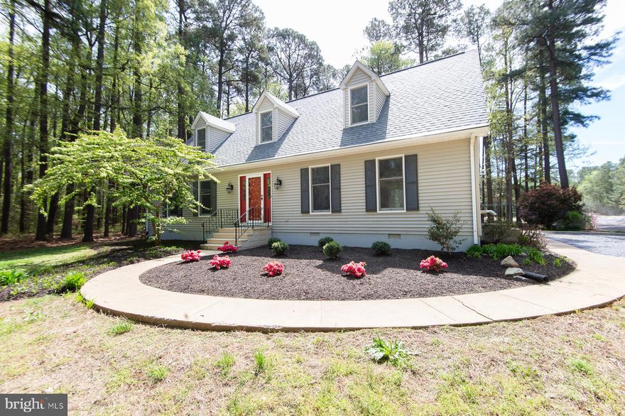 Completely renovated from top to bottom, this exceptional home sits on nearly 7 private acres in the highly sought-after Neck District of Dorchester County, offering the perfect blend of modern comfort and peaceful country living. A brand-new architectural shingle roof and thoughtfully redesigned open floor plan create a stunning great room where the kitchen, living, and dining areas flow seamlessly together—ideal for both everyday living and entertaining.

The beautifully updated kitchen features new countertops, a ceramic tile backsplash, and all-new appliances. Additional improvements include updated bathrooms, all new flooring, wiring, lighting fixtures, and fresh landscaping throughout—no detail has been overlooked.

The first floor offers two bedrooms and one full bath. Upstairs, the spacious primary suite includes a private bath and walk-in closet, along with two additional bedrooms and another full bathroom.

Step outside to a generous rear deck overlooking the pond and large outbuilding—an inviting space to grill, entertain guests, or simply unwind under the stars while taking in the serene surroundings. The expansive property is surrounded by mature woods teeming with deer, turkey, and other wildlife, creating a true retreat where privacy and nature take center stage.

A large metal outbuilding (45'x30') with a concrete floor provides endless possibilities for a home-based business, workshop, hobby space, or storage for boats and recreational equipment. Enjoy the quiet lifestyle of country living without sacrificing convenience—located less than 10 minutes from Cambridge.

A rare opportunity to own a fully renovated home in a private, natural setting designed for both relaxation and recreation.