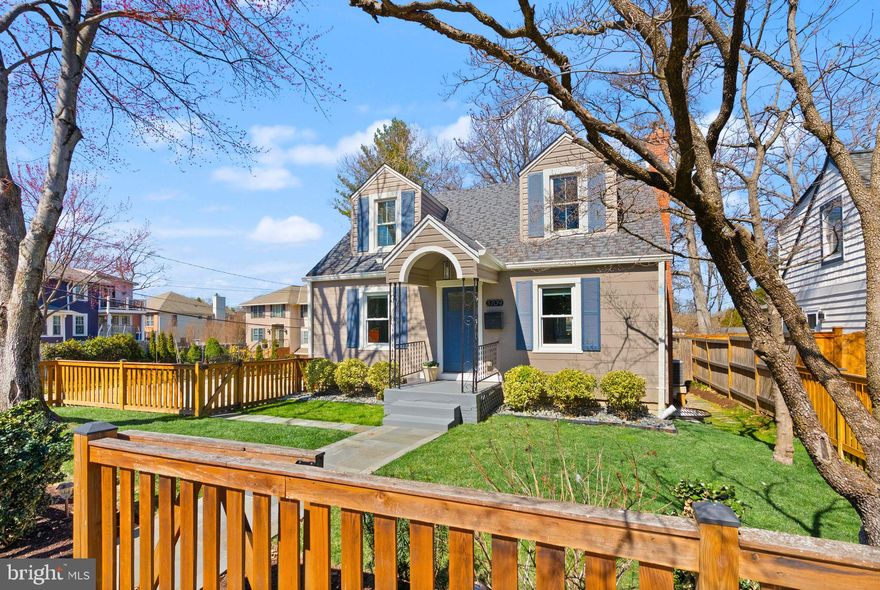 This beautiful, move-in-ready 5-bedroom, 4-bath 1940s Cape Cod has been beautifully expanded and thoughtfully updated with designer finishes throughout. A charming picket fence and flagstone walkway lead to the welcoming front entrance. Inside, the sunlit open-concept layout showcases gleaming hardwood floors, a spacious living room, and a dining area that seamlessly flows into a gorgeous kitchen. Featuring white shaker cabinetry, stainless steel appliances, Virginia Mist granite countertops, and elegant porcelain subway tiles, the kitchen is both stylish and functional. Toward the back of the home, a cozy breakfast nook and office space open to a deck overlooking the backyard. Two private main-level bedrooms, each with its own full bath, provide a retreat-like atmosphere. The upper level is a true primary sanctuary, complete with a spacious bedroom, a custom walk-in closet, a luxurious en-suite bath, a relaxing sitting area, an office nook, and a conveniently located laundry space. The expansive lower level features a large recreation room, two additional bedrooms, a full bath, a second laundry room, and a versatile bonus room with a door to the backyard. Step outside to professionally landscaped, fully fenced grounds with an irrigation system and mature plantings, creating a serene outdoor oasis. Nestled on a quiet street, this exceptional home is just three blocks from Arlington Science Focus Elementary and Washington-Liberty High School, as well as nearby dining and grocery stores. The Metro is only five blocks away, offering easy access to the city. With ample parking and a prime location within walking distance of Clarendon’s vibrant shopping, dining, and entertainment scene, this home is a rare gem.