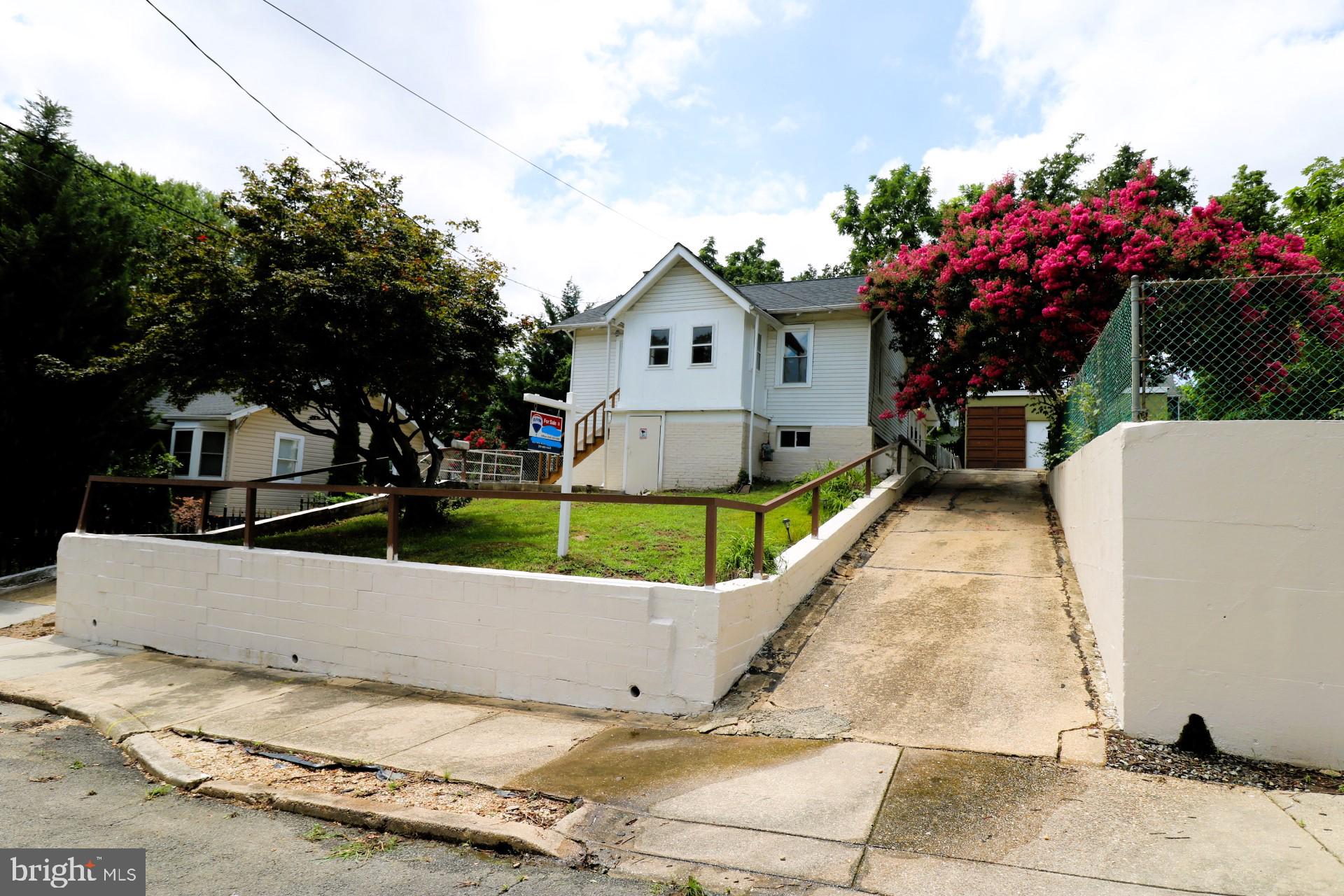 Don’t miss this once in a lifetime “double shot” gem! (House & Empty lot next door). This property is located in the tucked-away mature Mount Rainier community, less than 1 mile to the Washington DC line yet far enough to still enjoy the peace and tranquility of a Maryland suburb. With easy access to major routes including Rt-1 (0.25 mi), Rt-50 (1.15 mi), The Shops at Dakota Crossing located less than 1 mile away, less than a quarter mile to the Rhode Island Ave at Mount Rainier bus terminal, tons of shopping and dining just to name a few. The top level includes a kitchen, 3 generous sized rooms, a full bath, a closed in patio in the front, a huge flex area in the rear accompanied by a fireplace for soothing and a laundry room. The basement has been left wide open to allow for your creative juices and personal touch. The huge garage in the rear can easily accommodate 3-4 cars…or perhaps a Music studio? Pilates studio? The sky is the limit and...NO HOA! Tons of improvements; All new full paint job, new roof 2023, new basement floor 2022, garage new concrete floors and drainage system 2022, rebuild retaining walls 2022, front and rear new windows 2020, 200 Amp Heavy up 2008, new water heater 2018, garage new electrical panel with 8 slots and lamps installed 2017, new AC system 2017, rebuild furnace with new coil and condenser 2017, newer dish washer, newer stove, newer refrigerator 2018, too much to mention. Tons of improvement have been done to this house though it may still need some TLC depending on your taste and standards. Please note that the seller wishes to seller this property together as a package deal with the empty lot 7 next door located at 3722 Wells Ave (MLS: MDPG2158106). 1031 Exchange applicable, seller prefers Brennan Real Estate Exchange Corp. Contact friendly agent for more information…DOUBLE SHOT!
