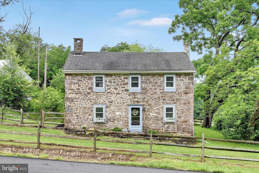 Welcome to Cavan Dreams Farm, a charming 1850 stone farmhouse set on 3.94 picturesque acres in Douglasville. Rich in character and history, this beautifully preserved home offers a rare blend of timeless craftsmanship, comfortable living, and a well-appointed equestrian setup.
Inside, the home showcases exposed original stone walls, deep-sill windows, and beautiful hardwood floors that highlight its historic appeal. The living room is anchored by an original stone fireplace that serves as the focal point, creating a warm and inviting space filled with character.
The large country kitchen features granite countertops, ample cabinetry, and views of the surrounding horse pastures.  The spacious dining room includes a custom-built dining table that will remain with the home, offering a perfect gathering space. A first-floor office overlooking the horse pastures, and opens to a large deck where sounds of horses grazing and birds chirping create a soothing soundtrack daily life and an unbeatable sense of calm.
The second floor offers three bedrooms, a full bathroom, and a walk-in hall closet, combining practicality with classic farmhouse charm. 
Outside, the property truly shines for the equestrian enthusiast. The land is thoughtfully laid out with four fenced pastures and a small dry lot, offering flexibility for turnout and pasture management. A three-stall barn with a new roof includes a tack room, feed room, and wash stall with hot and cold water, providing a functional setup for daily care. A separate hay storage barn can accommodate up to 200 bales of hay.
Last but certainly not least, the property features a 120 x 60 lighted indoor arena with all new sand and rubber footing, allowing for year-round riding and training regardless of the weather.
Additional exterior highlights include a detached oversized three-car garage and a fully fenced front yard, ideal for pets or added privacy.
Conveniently located within walking distance to Daniel Boone High School, just minutes from Chester County, and close to major routes, this property offers a rare opportunity to enjoy a true equestrian lifestyle with everyday convenience.
A remarkable offering for those seeking a historic farmhouse paired with a complete, turn-key horse property where timeless character meets functional equestrian living.