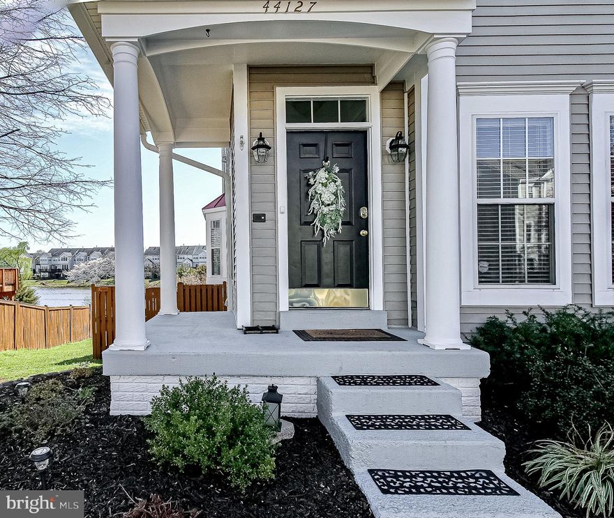 This is THE ONE!!! you've been looking for. This lake-front, end unit  townhome is filled with sunlight while its open floorplan flows into ideal space for entertaining a/o everyday living. Enjoy beautiful lake views from all 3 levels or enjoy the sunset over the lake from your spacious trex deck on the main level or wood deck on the lower level.  The gourmet kitchen  boasts stainless steel appliances-a French, double door refrigerator,  a KitchenAid stove/, microwave/convection oven & granite counters. There are 4 ceiling fans throughout as well as custom  moldings on the first level. Well-maintained & improved (over $50k in the past) , the newer additions include: hickory hardwood floors & fresh paint. Almost 2100sq ft on 3 levels--with a walkout lower level to a fenced & beautifully-landscaped rear yard which leads to the lake & open space. Convenient, reserved parking at the front door. The BEST of locations in this desirable  & easy-commute  community & walking distance to the W&OD  Trail. Enjoy "special time" by the gas fireplace in the Family Room adjacent to the sizable kitchen or enjoy the spacious lower level for a game room, an office, a playroom, or extra bedroom. There's even a new electric fireplace on the wall downstairs. This wonderful community's amenities include: a baseball field, basketball courts, bike trails, soccer field, a full gym/fitness center, picnic areas, indoor & outdoor pools, pier/dock, lake, meeting room, walking & jogging paths. Nearby is the future Silver Line Metro.  RT.7 & 38, the Dulles Greenway & Dulles Airport are all convenient to Ashburn Village. One Loudon, shopping & restaurants are all a short drive away.