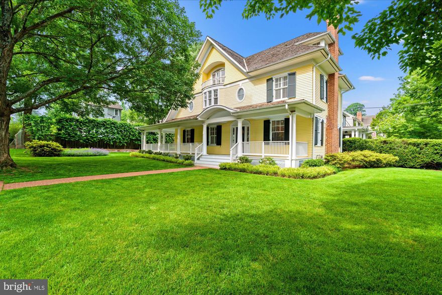 Welcome to this extraordinary residence, where timeless charm meets modern sophistication. Originally a 1920s Sears kit home, this property was masterfully transformed by award-winning architect Mark McInturff. While the traditional exterior maintains its classic appeal, the interior unfolds into an open, light-filled layout with clean lines, modern finishes, and exceptional craftsmanship.

Inside, soaring 9-foot ceilings and maple flooring create a warm and inviting atmosphere. A gracious center hall opens to a sunlit living room with a gas fireplace on one side and a spacious dining room on the other, which flows seamlessly into the custom family room and kitchen. The family room features exquisite maple cabinetry and built-ins, echoing the tone of the maple floors and offering direct access to an expansive 8-foot-deep wraparound porch—ideal for entertaining and everyday enjoyment. The kitchen is outfitted with high-end modern appliances and blends beautifully with the open floor plan. Built-in cabinets extend all the way to the ceiling, providing exceptional additional storage space.

Upstairs, the primary suite is a true retreat, boasting a sunny sitting area, a turret-like vaulted ceiling, generous closet spaces, a gas fireplace, and a spacious bath. A second bedroom—formerly two rooms—offers flexibility, while a hall bath and a BONUS room (ideal for a small office, laundry, or future third bath with existing plumbing) complete this level. See Virtually staged photos. for ideas. The top floor showcases two oversized rooms with vaulted ceilings, window seats, and abundant natural light from a dramatic third-floor skylight. A standout architectural element is the award-winning maple staircase with contemporary cable railing, which visually connects all three levels with elegance and light.

The lower level includes a Refreshed laundry area, Refreshed Storage Room/Playroom, workshop, and ample storage. Outside, the lushly landscaped lot is a private oasis with mature Plane Trees, Astor, Nepeta, and manicured lawn and hardscape—reflecting years of thoughtful care.

Set in the highly sought-after Section 5 of the Village of Chevy Chase, this home enjoys a rare blend of neighborhood charm and walkable amenities, just steps from La Ferme, Brookville Market, local shops, and two prestigious private clubs. Its location offers convenient access to both downtown Bethesda and Washington, D.C.—an exceptional opportunity in a truly magical setting.