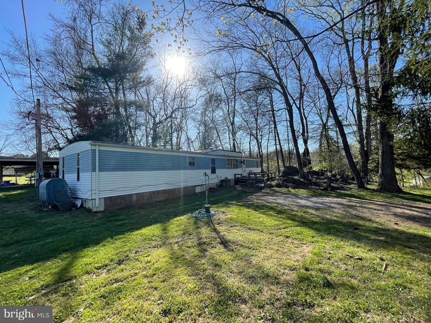 Here is an opportunity to own a  1.10 acre lot in the Potomac Hills subdivision. There is currently an older 2 bedroom 1 bath mobile home that is rented out to long-term tenants. Large front and rear deck. Also a nice covered picnic area in the back.   The adjoining property, 459  Burnside Dr. consisting of 1.11 acres is also listed for sale.  Continue with the current tenant situation, or place a new manufactured or stick built home on the site. This lot has a well and septic. New furnace in 2016. New water heater 4/12/23. The home is not on a permanent foundation. The community offers river access which is only a 1/4 mile walk or drive from the property.  With the property being tenant occupied, we request 24 hour notice for showings. The property is being sold strictly as-is. Due to type, age, and condition of property, financing will likely be a challenge. Please contact your lender to discuss prior to requesting a showing.
