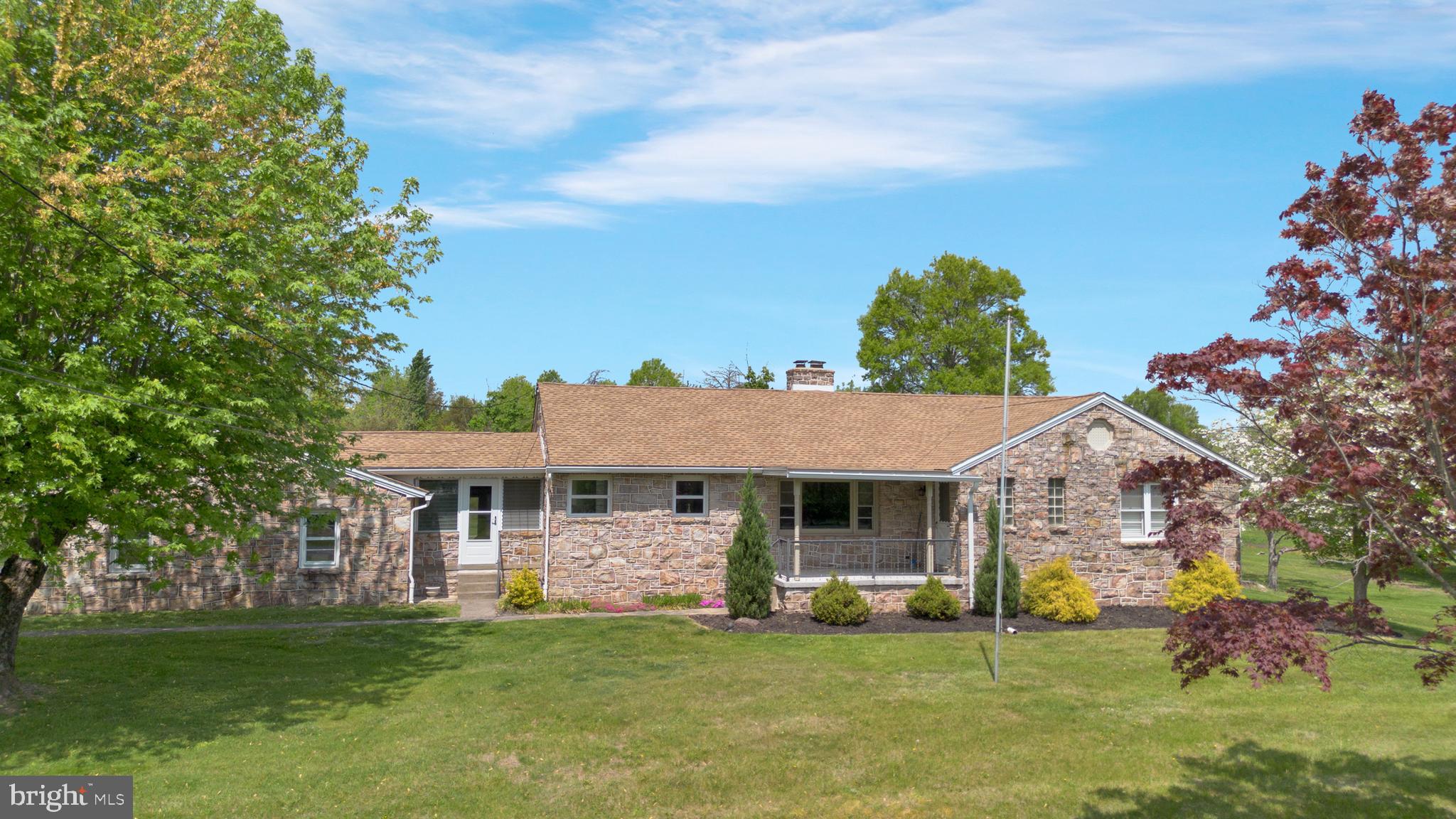 Beautiful 1676 sq ft stone ranch home located in a quiet country setting in Upper Salford Township (Harleysville address), Montgomery County, and the very desirable Souderton Area School District. The home has been renovated in recent years and the high level of craftsmanship is evident - hardwood flooring, ceramic tile flooring, fresh paint, lighting, newer 200 AMP electric panel, generator hook-up, newer front door, and remodeled kitchen and baths. Includes 3 bedrooms, 1.5 baths, kitchen, dining room, and living room with an open floor plan and loads of natural light. Additionally, there's a walk-up attic, a full basement, an enclosed breezeway, oversized 2 car garage, shed, and a large double wide driveway... all on a 1.71 acre lawn and treed lot! Close to schools, parks, shopping, and dining in Harleysville, Telford, Souderton. Plus conveniently located near commuter routes Rt 63, Rt 113, Rt 309, Rt 29, and Ridge Rd (Rt 563). Make your appointment to see this property today!